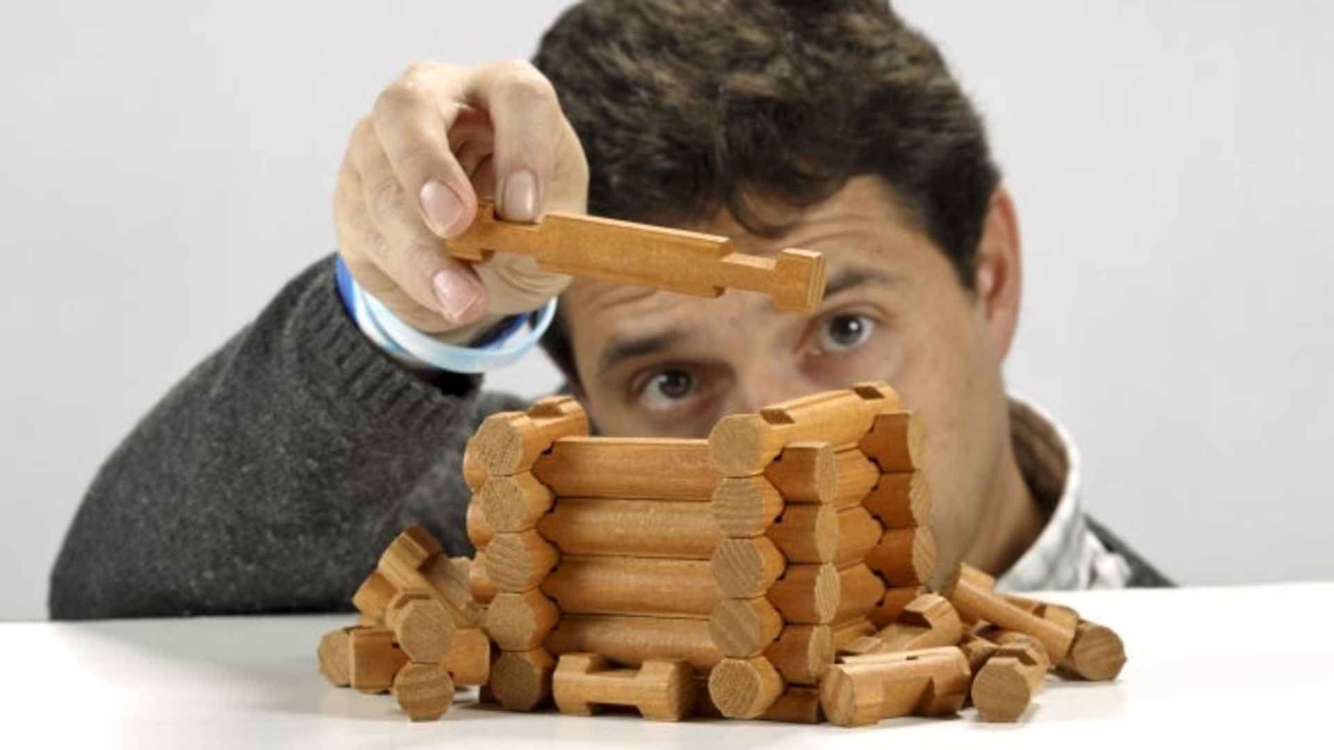 Man with Lincoln logs. (Credit: David Cooper/Toronto Star/Getty Images)