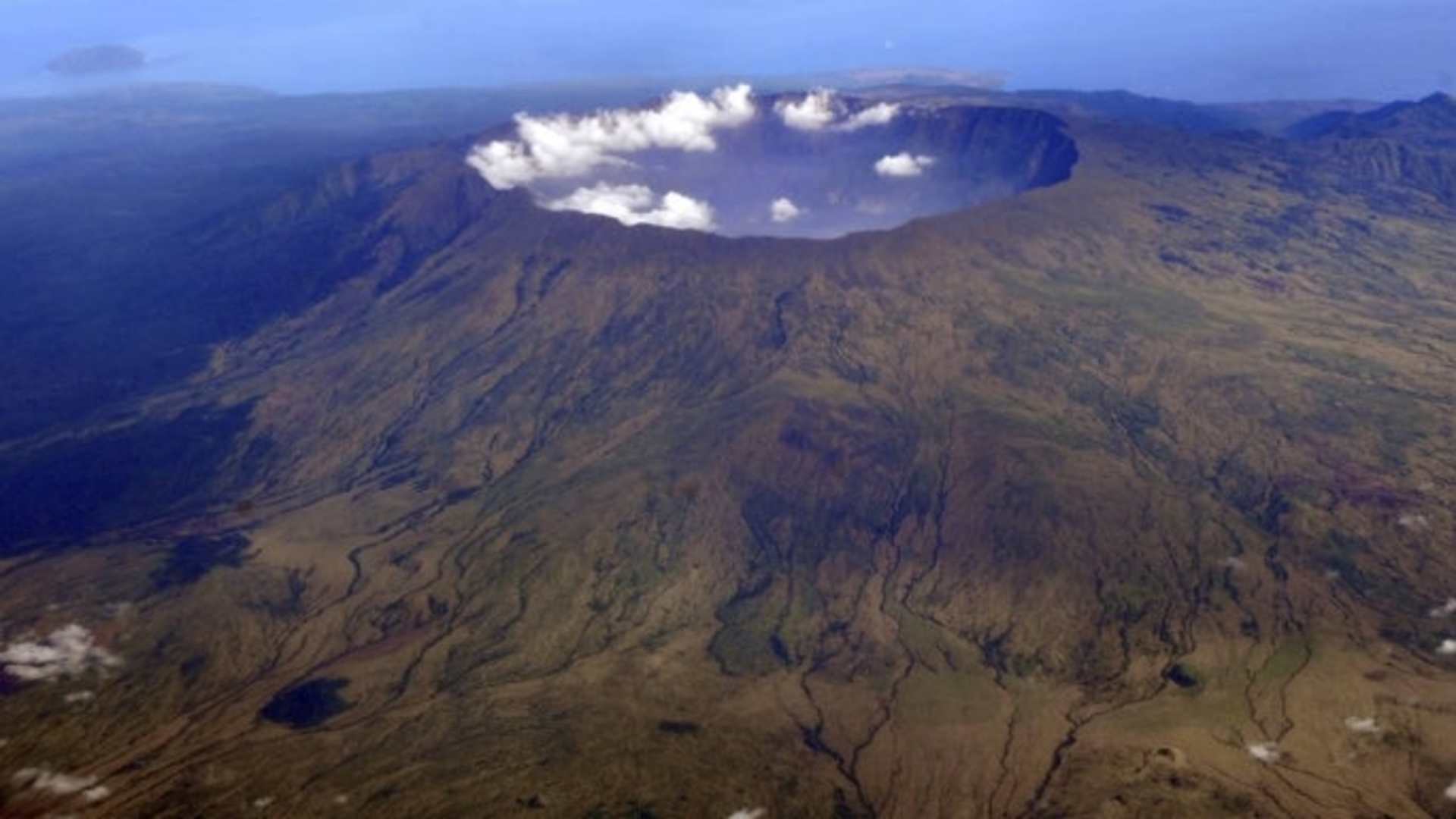 A 2010 aerial photo of Mount Tambora's 10 volcanic crater that stretches over 7 miles wide and about half a mile deep. It was formed by the April 1815 eruption. (Credit: Iwan Setiyawan/KOMPAS Images/AP Photo)