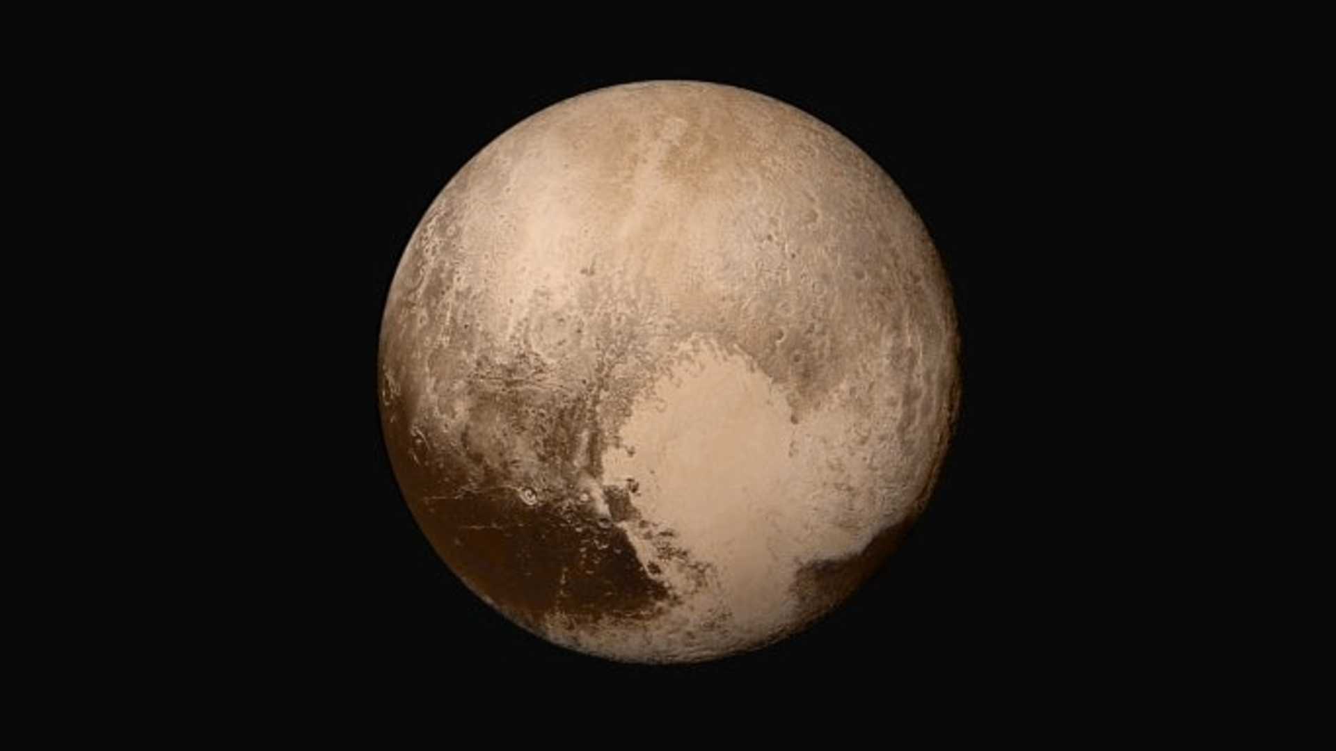IN SPACE - JULY 14: In this handout provided by the National Aeronautics and Space Administration (NASA), Pluto nearly fills the frame in this image from the Long Range Reconnaissance Imager (LORRI) aboard NASA's New Horizons spacecraft, taken on July 13, 2015, when the spacecraft was 476,000 miles (768,000 kilometers) from the surface. This is the last and most detailed image sent to Earth before the spacecraft's closest approach to Pluto. New Horizons spacecraft is nearing its July 14 fly-by when it will close to a distance of about 7,800 miles (12,500 kilometers). The 1,050-pound piano sized probe, which was launched January 19, 2006 aboard an Atlas V rocket from Cape Canaveral, Florida, is traveling 30,800 mph as it approaches. (Photo by NASA/APL/SwRI via Getty Images)