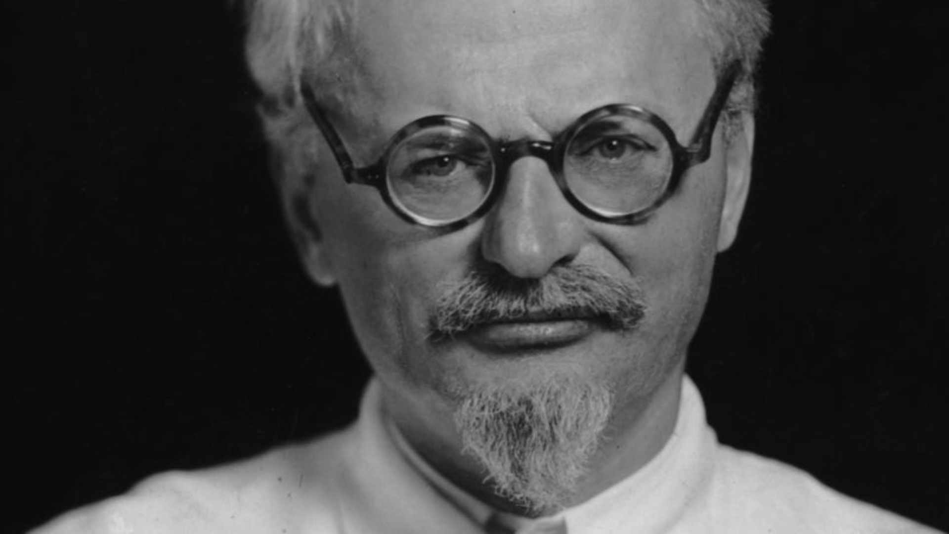 circa 1935: Studio portrait of Russian Communist leader Leon Trotsky (1879 - 1940), wearing eyeglasses and a white jacket. (Photo by Hulton Archive/Getty Images)