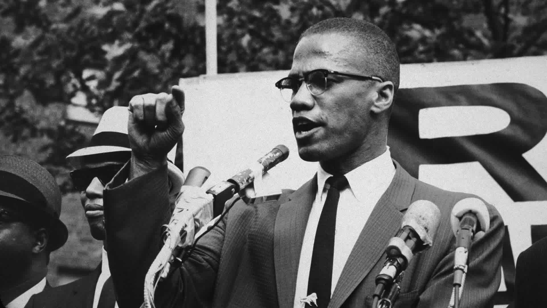 circa 1963: American civil rights leader Malcolm X (1925 - 1965) at an outdoor rally, probably in New York City. (Photo by Bob Parent/Hulton Archive/Getty Images)