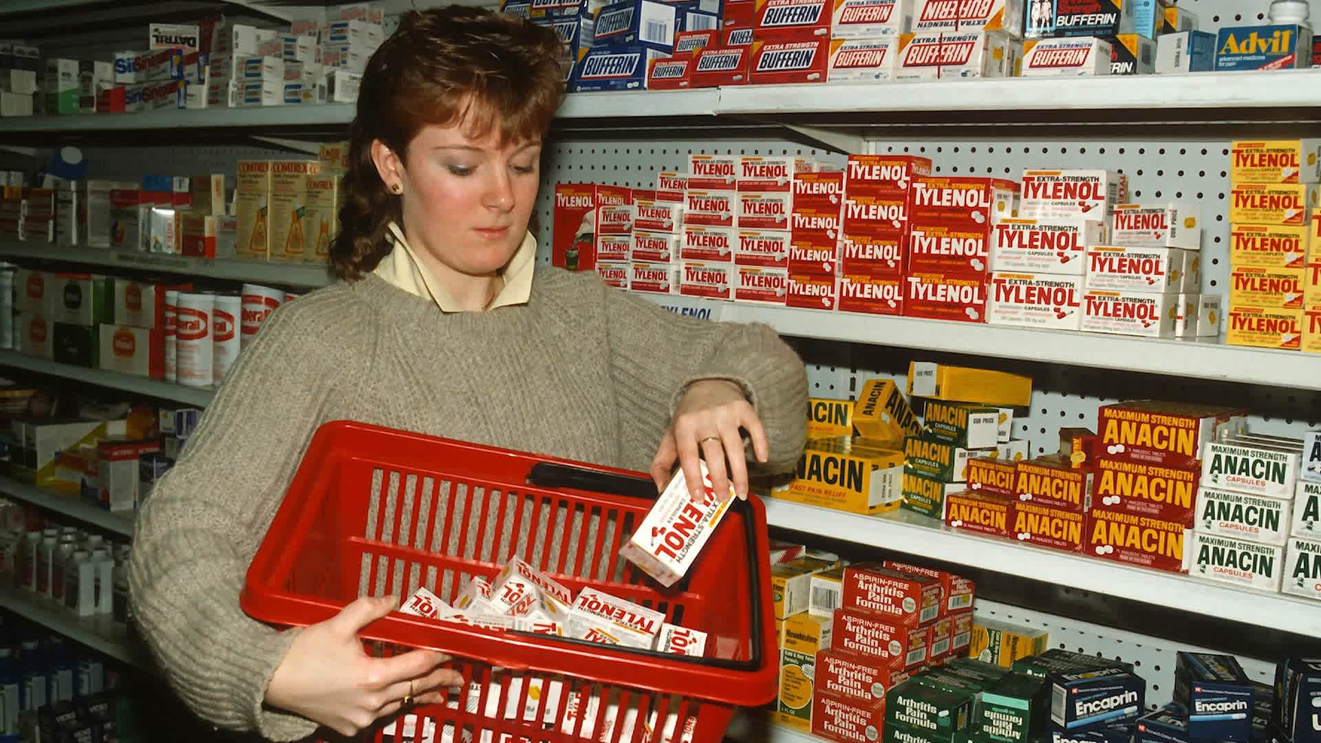 A drugstore clerk removes Tylenol capsules from the shelves of a pharmacy on September 30, 1982 in New York City after reports of tampering. Seven people died in Chicago after taking Tylenol.