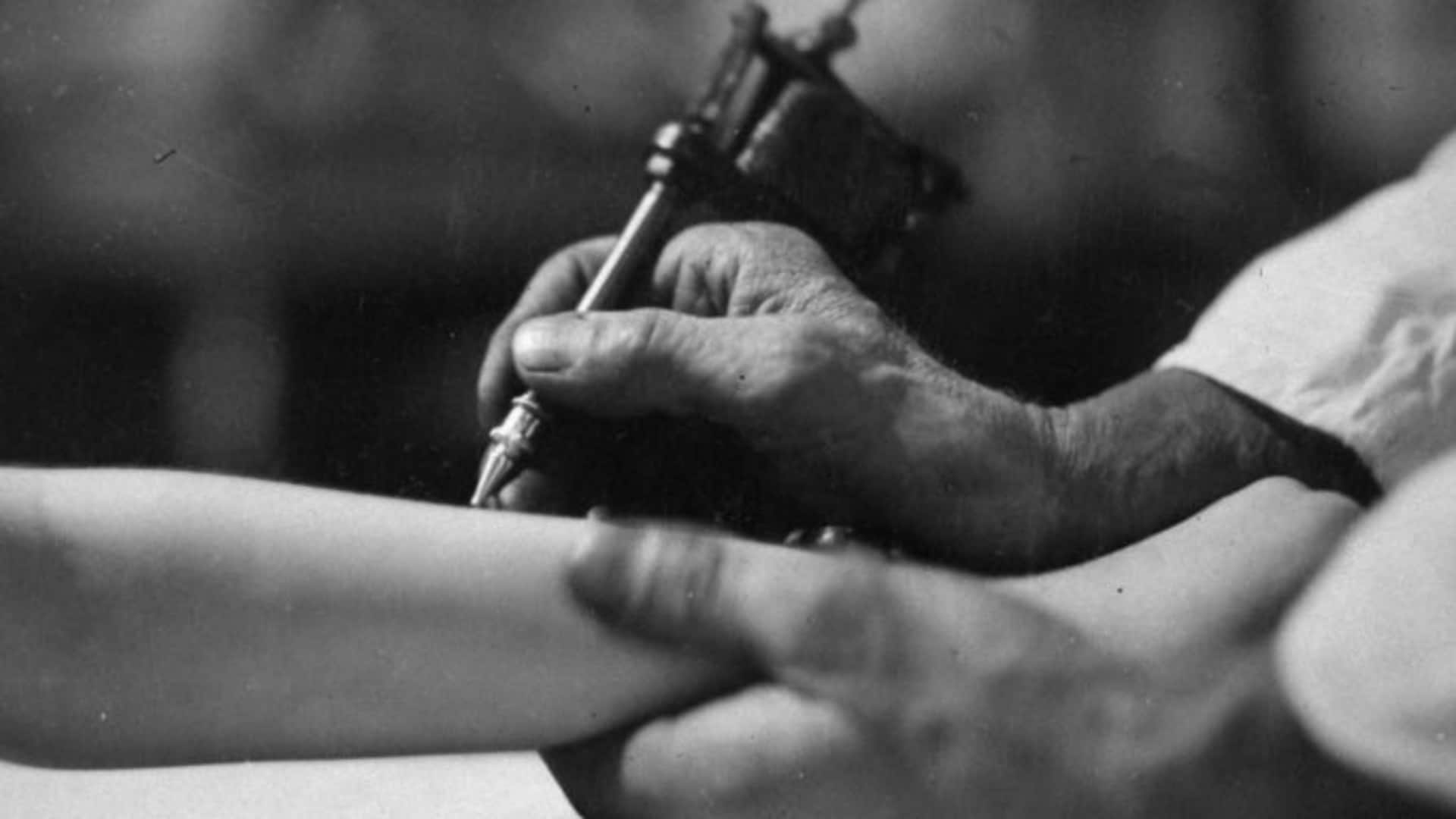 Closeup of a tattooist at work. (Credit: E. O. Hoppe/Mansell/The LIFE Picture Collection/Getty Images)