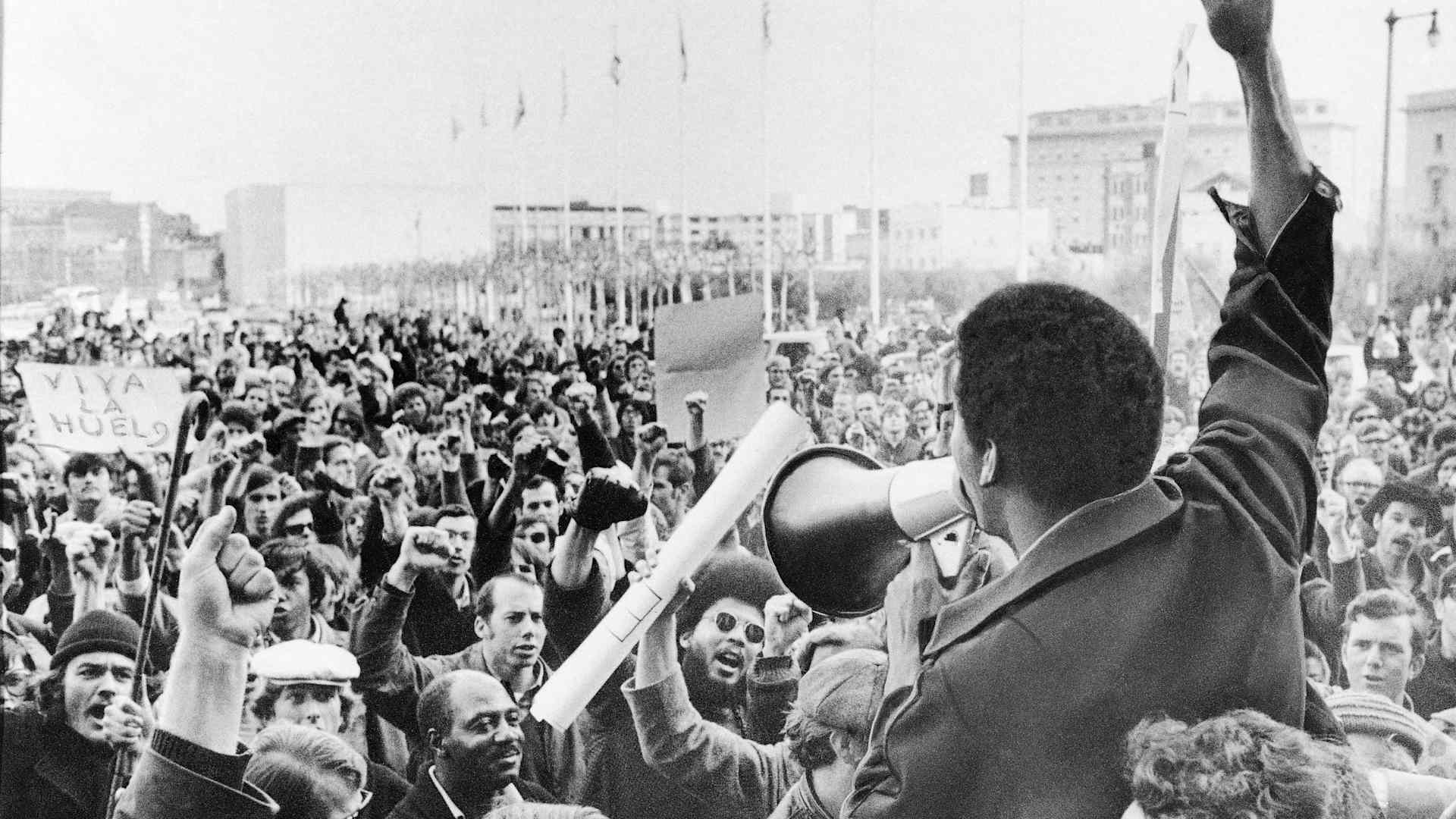 A Black Students Union leader in front of a crowd of demonstrators at San Francisco State College in December 1968. The union had gone on strike after racial strife between students and administration.