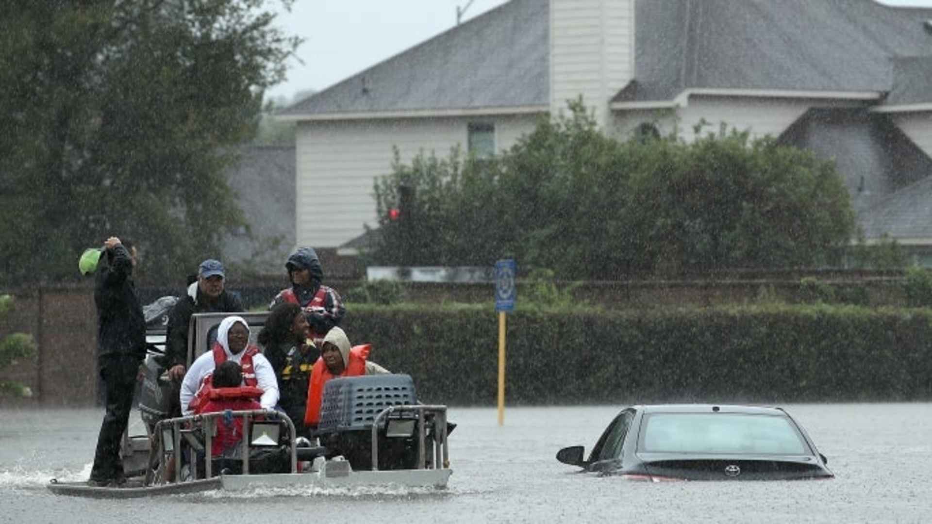 Residents are evacuated from their homes after severe flooding following Hurricane Harvey on August 28, 2017 in Houston, Texas.