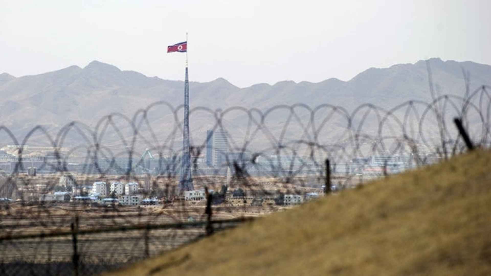 North Korea's propaganda village of Gijeongdong as seen through barbed wire from the the Joint Security Area of the Demilitarized Zone on the border between North and South Korea. (Credit: Saul Loeb/AFP/Getty Images)