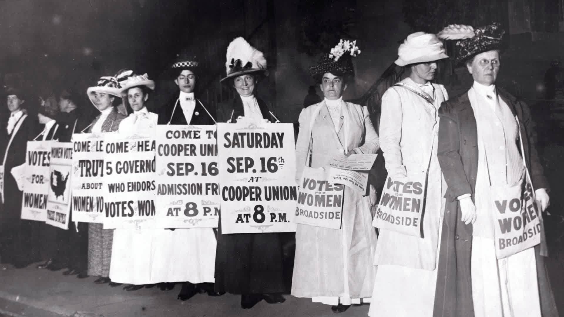 Suffragettes Marching with Signs(Original Caption) New York: New York Society Woman Suffragettes as sandwich men advertise a mass meeting to be addressed by the Governor of the Suffrage states. Photograph.