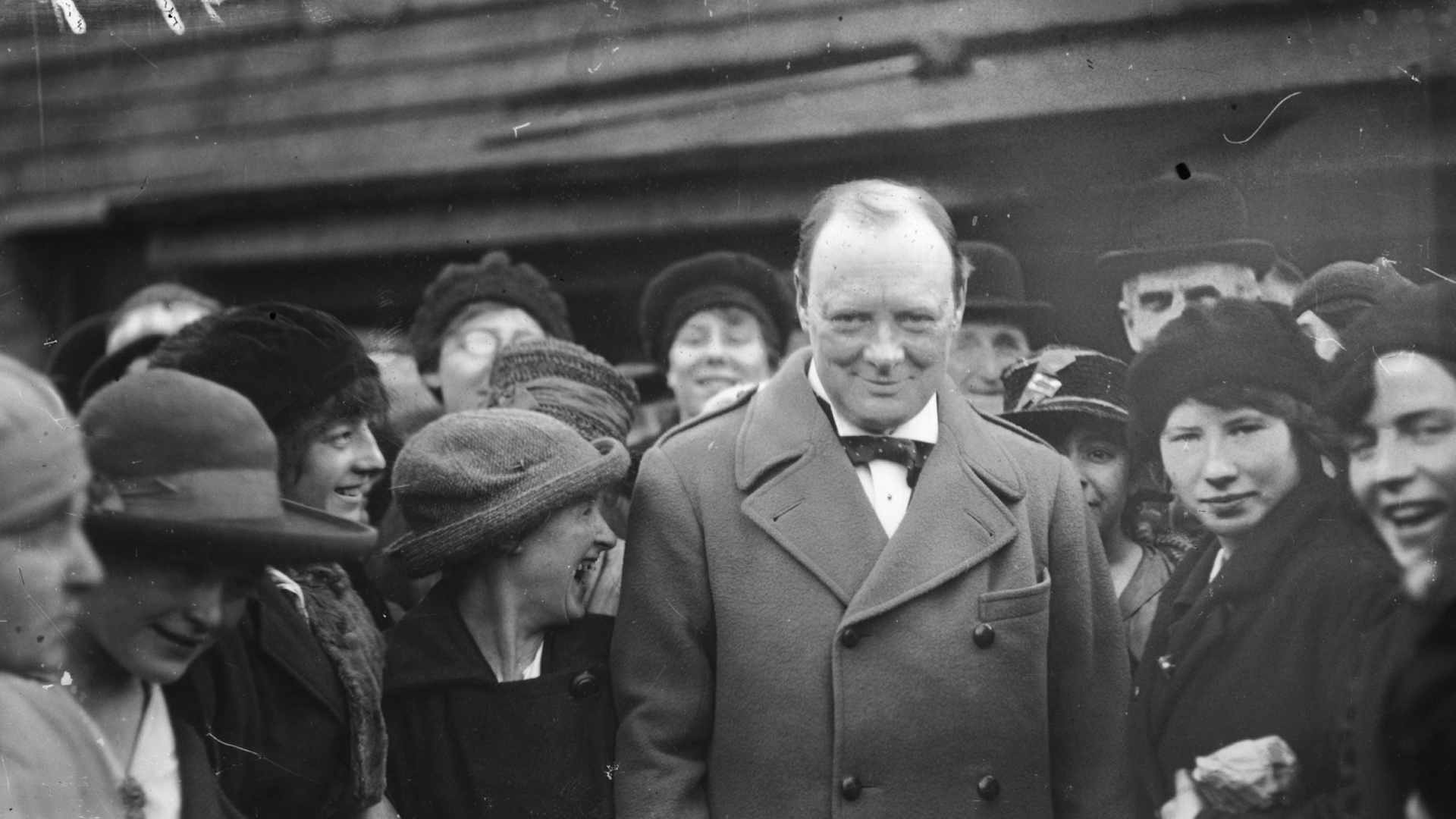 Winston Churchill (1874 - 1965) is escorted through the yards by girl workers whilst on his visit to the north, 1918. (Photo by A. R. Coster/Topical Press Agency/Getty Images)