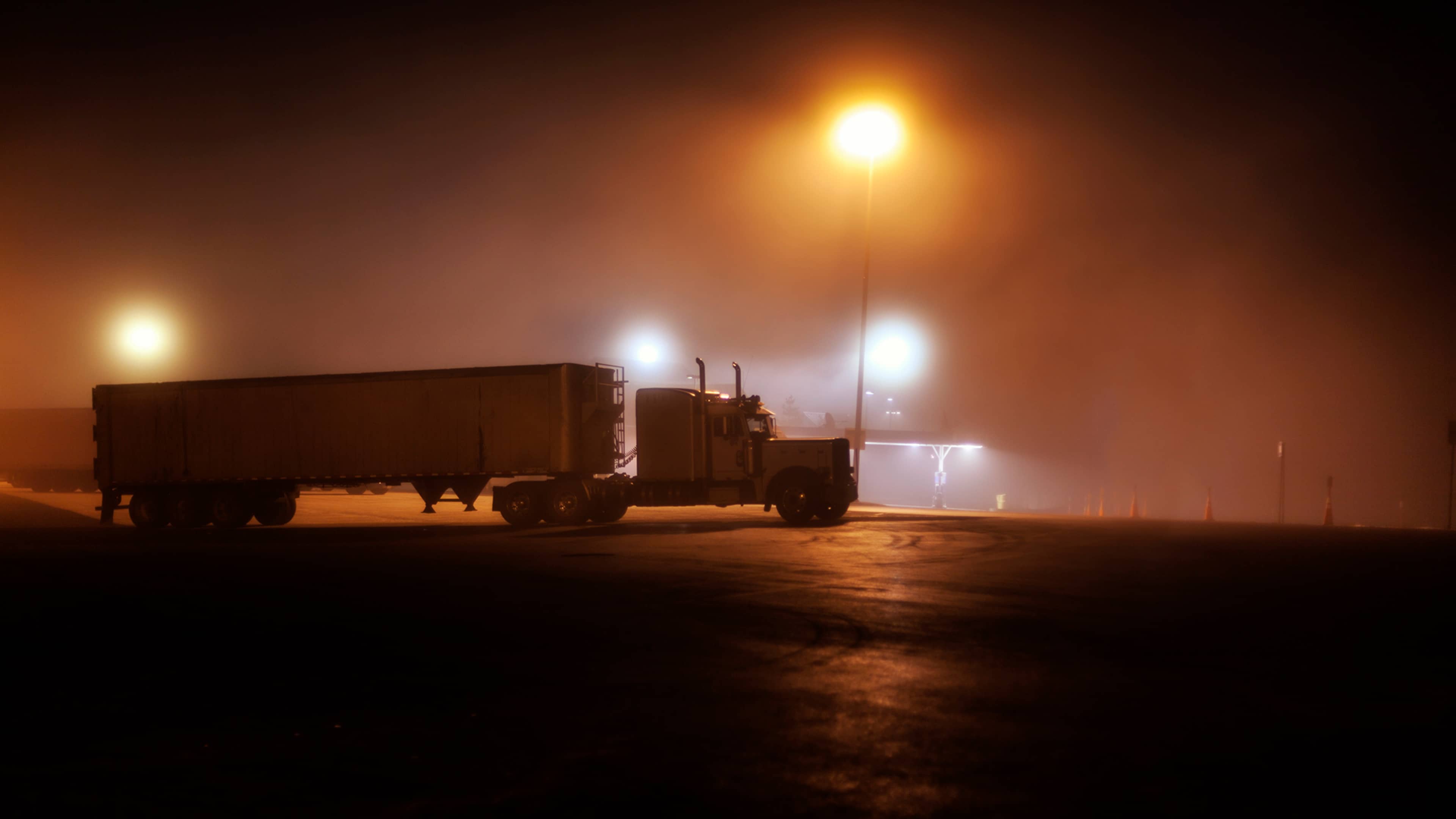 Midnight Interstate Expressway Foggy Rest Stop Parked Trailer Truck