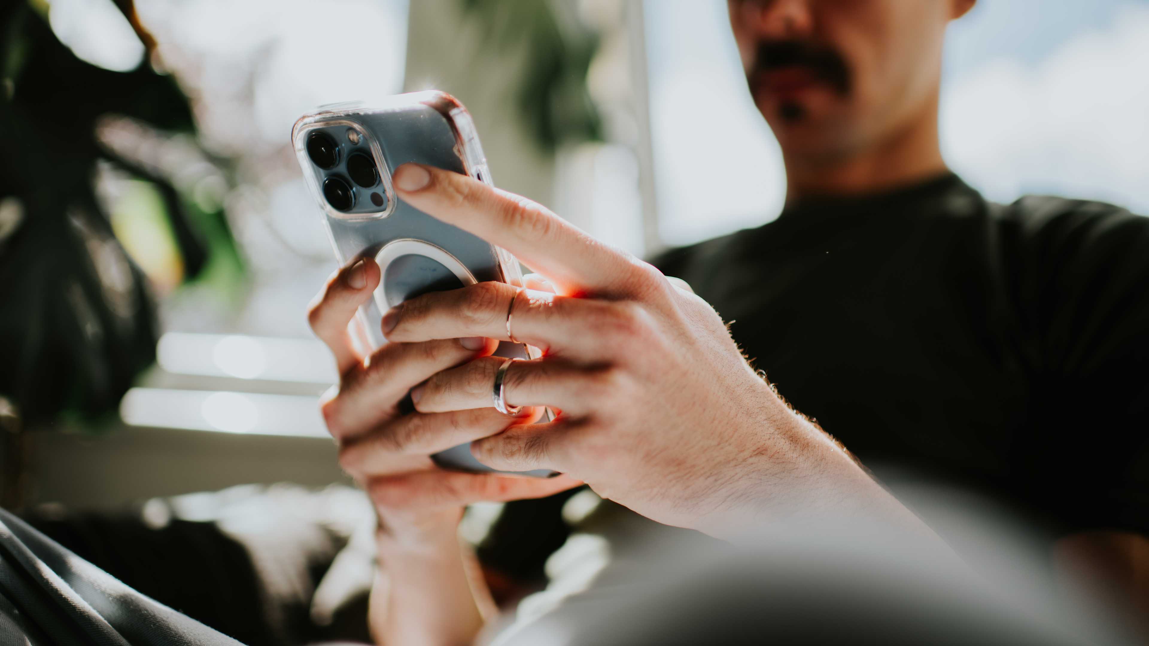 Close-up of a man using a smart phone