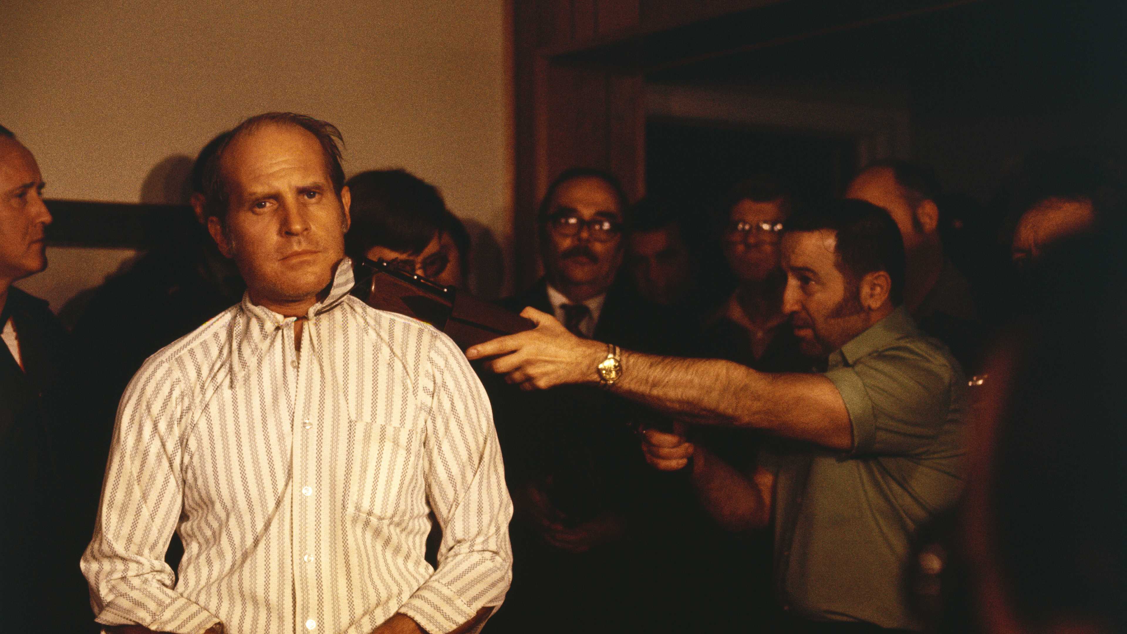 Man Holding Gun to Hostage