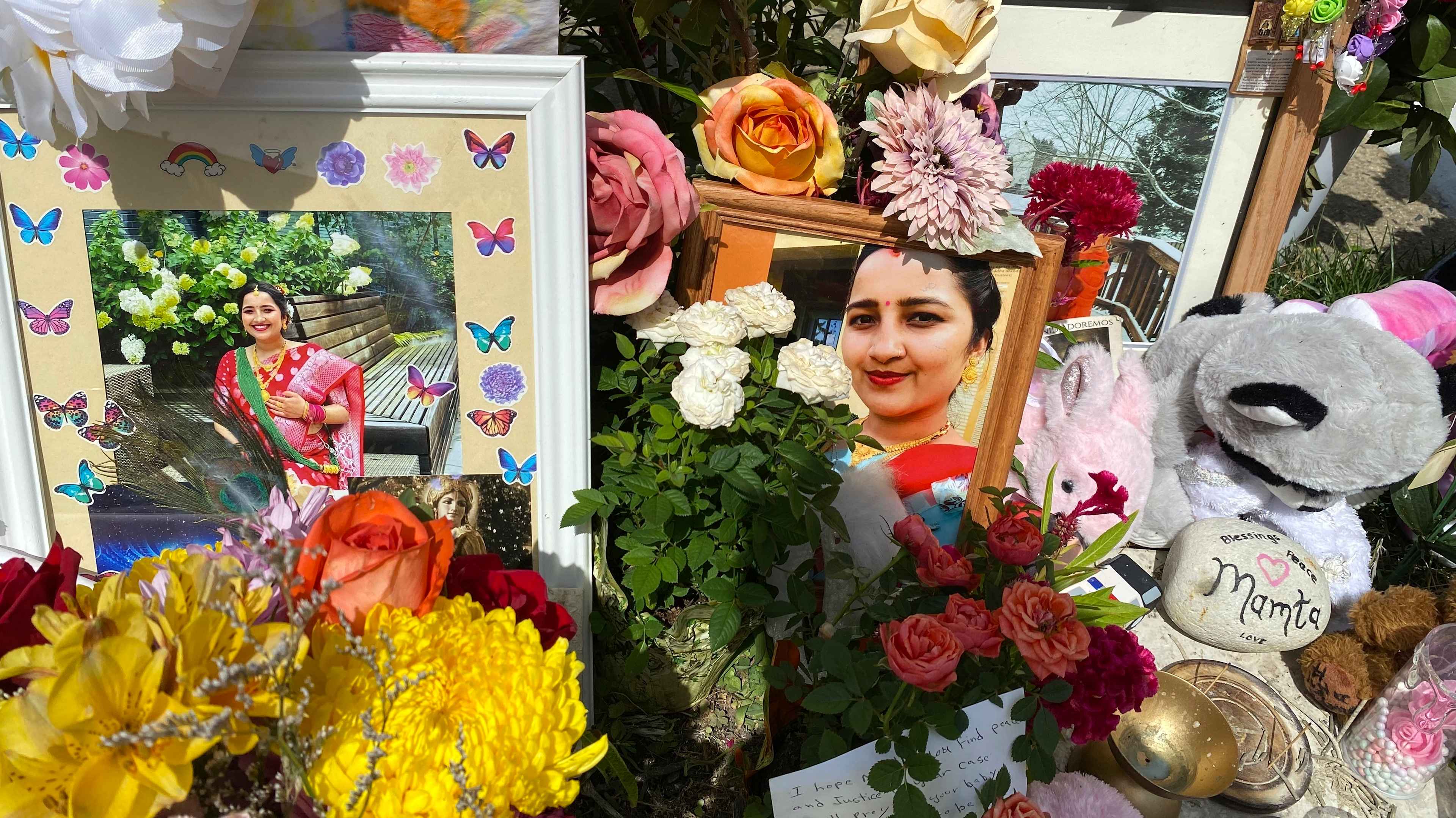 Flowers, candles and photos were placed near Mamta Kafle Bhatt's mailbox in Manassas Park, Va., Thursday, Sept. 4, 2024 in Manassas Park, Va.