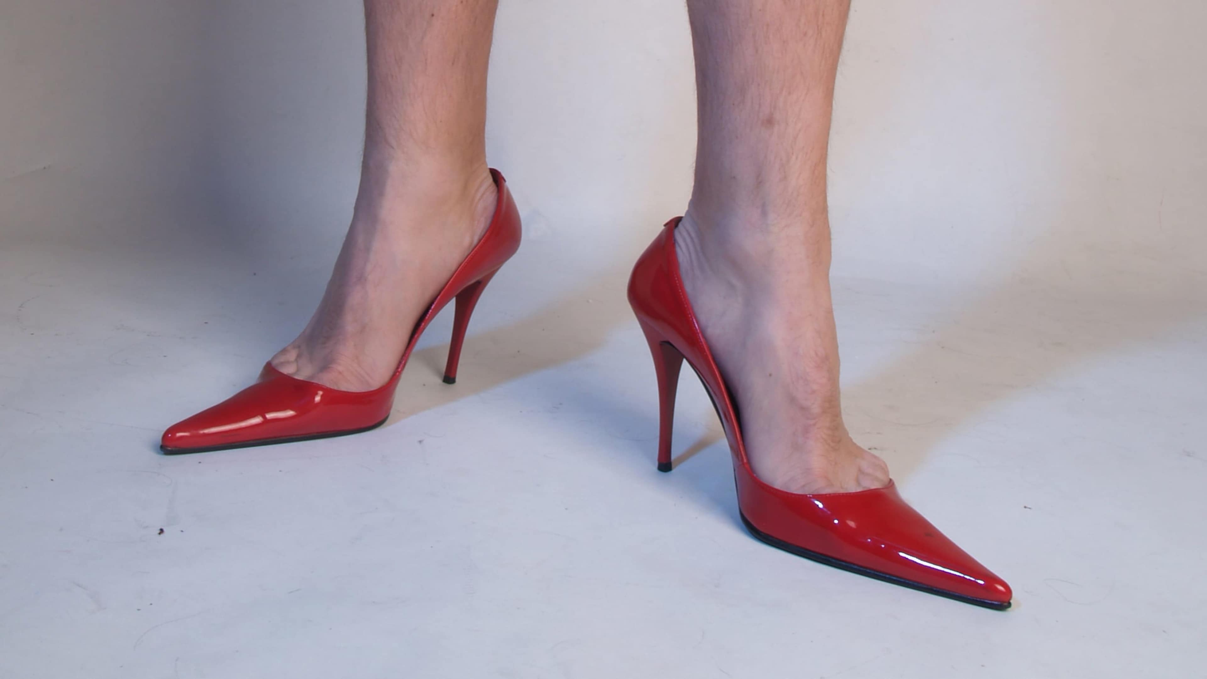 Male legs and red shoes