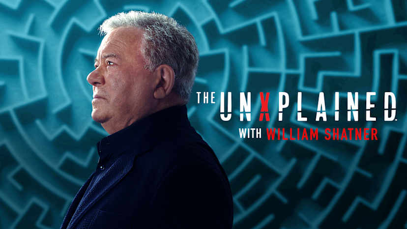 The image shows a middle-aged man with gray hair in a serious expression against a vibrant, abstract blue background with geometric patterns.