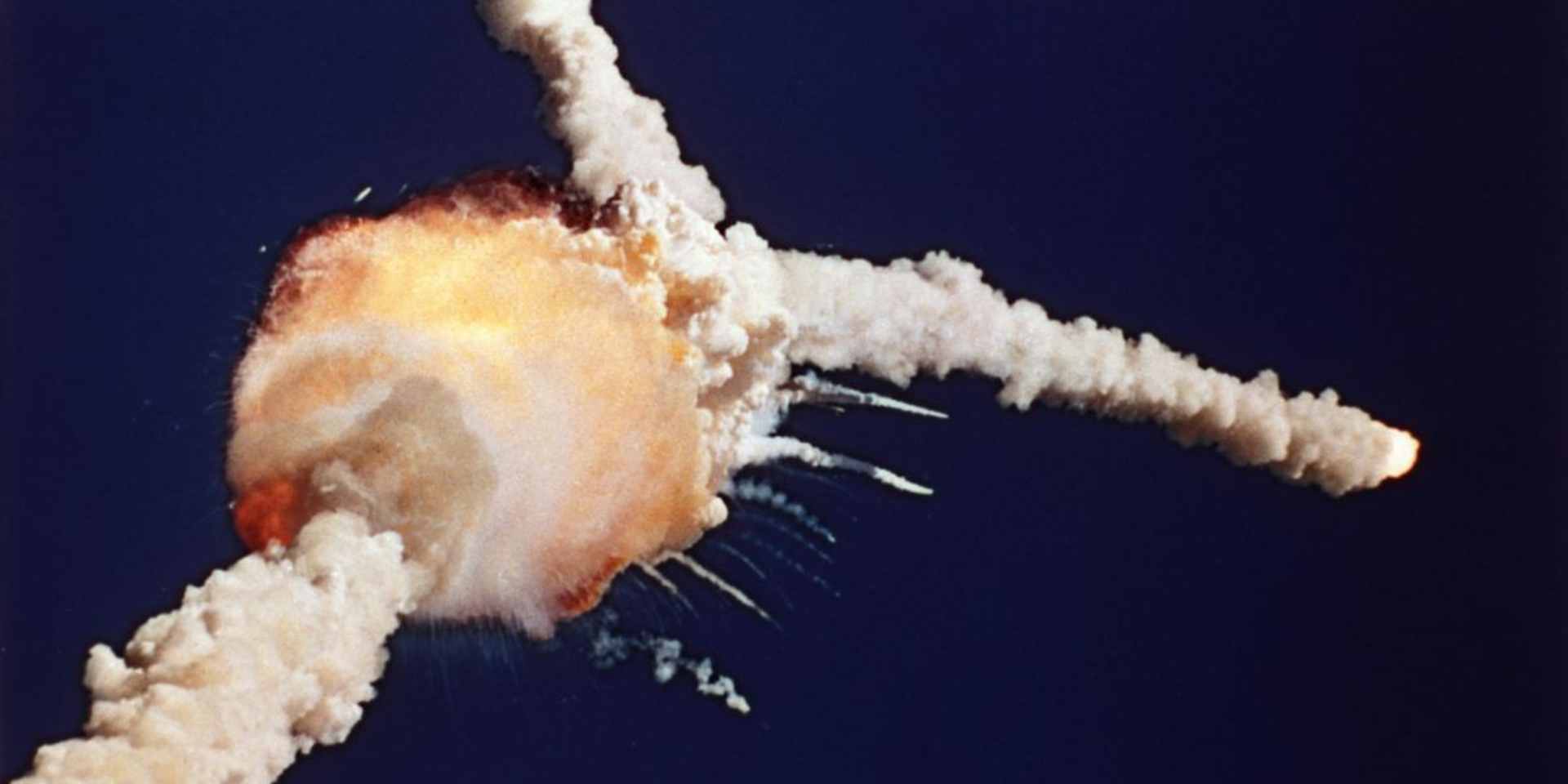 The space shuttle Challenger explodes after liftoff