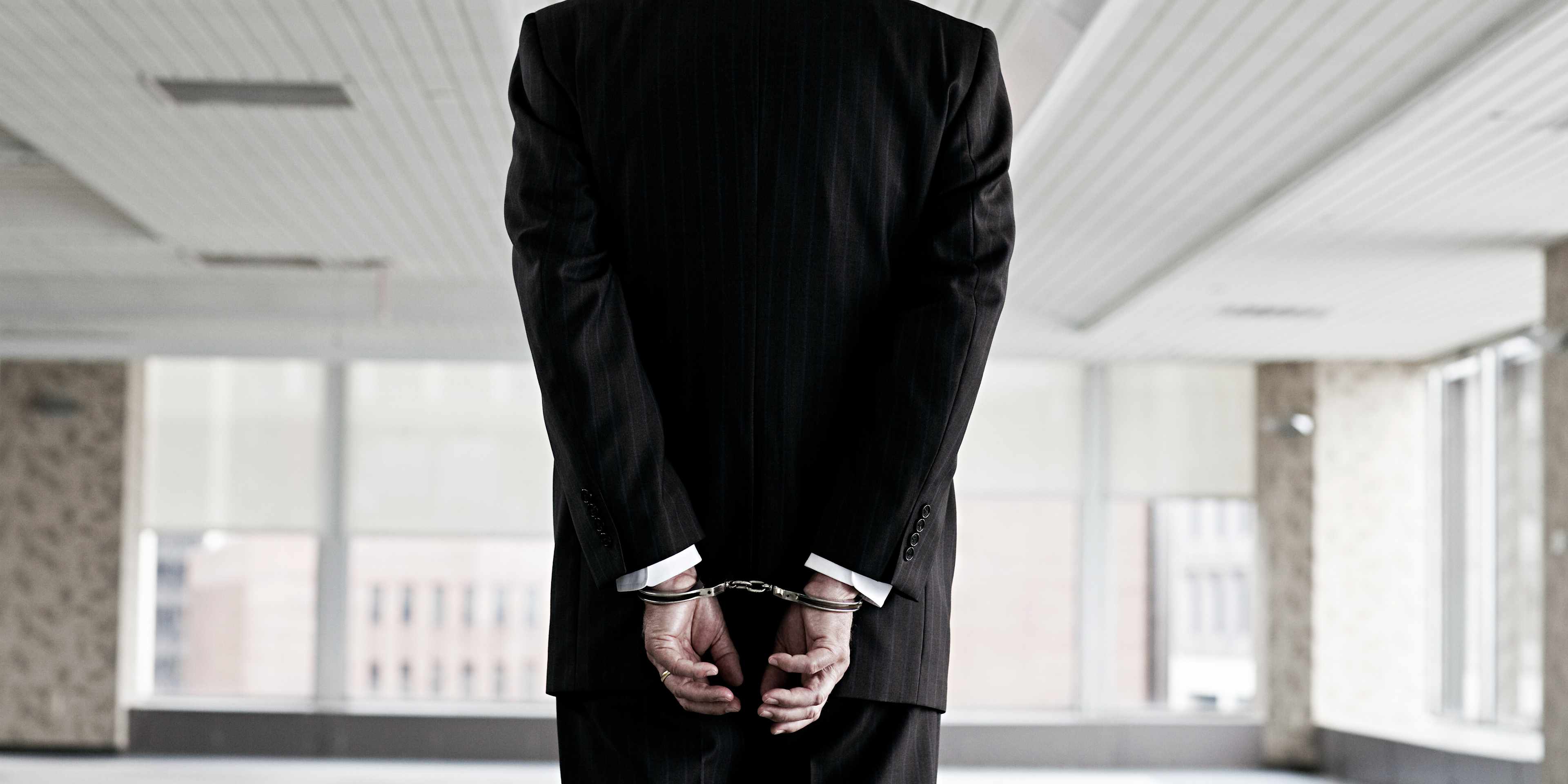 Businessman in handcuffs