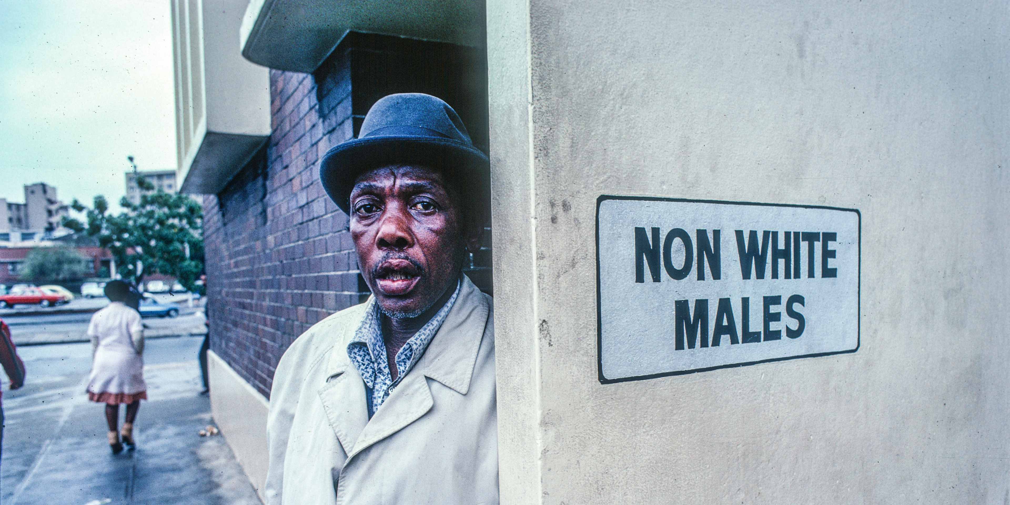 Man Outside A Segregated Restroom