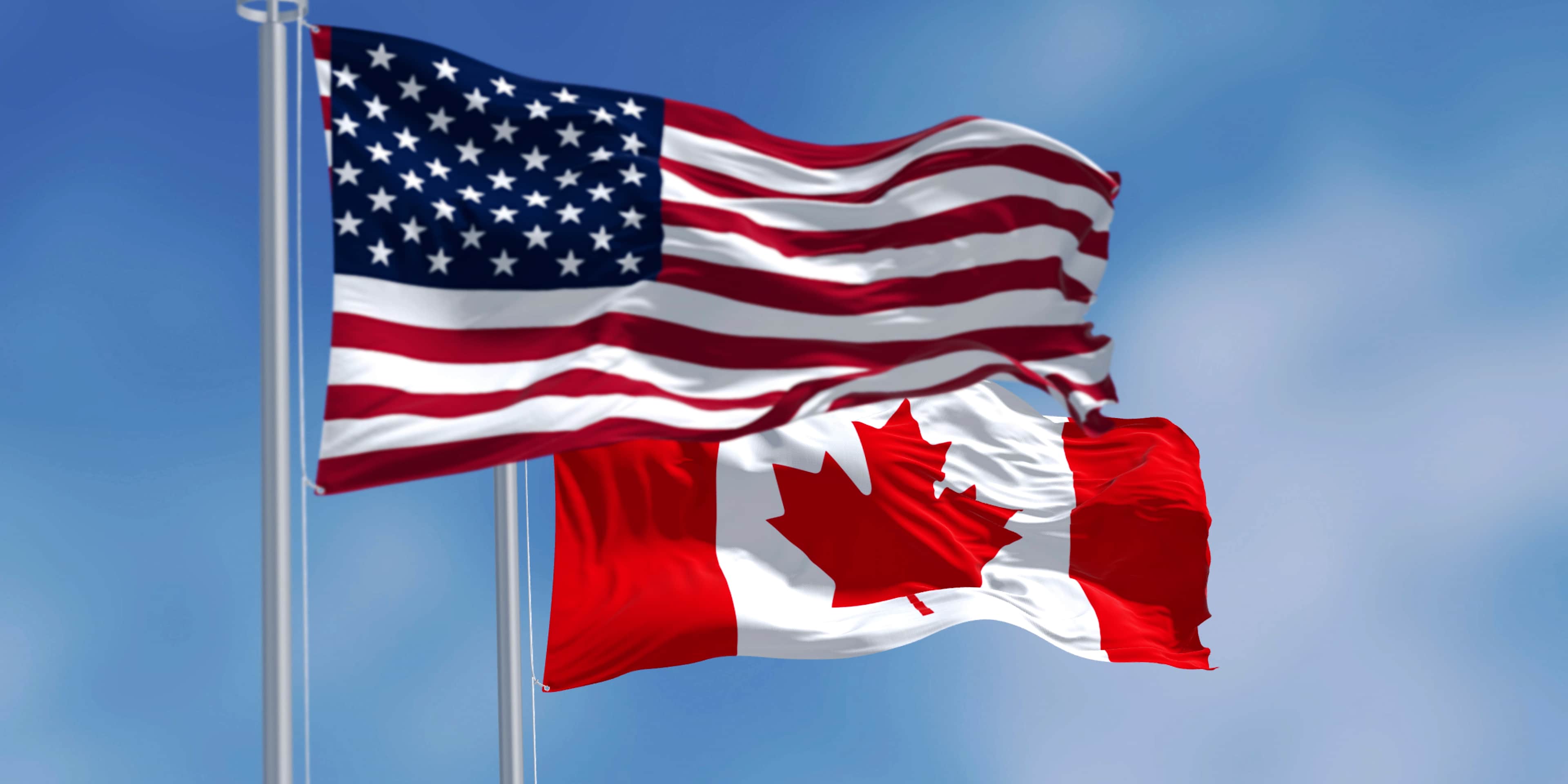 U.S. and Canadian flags.
