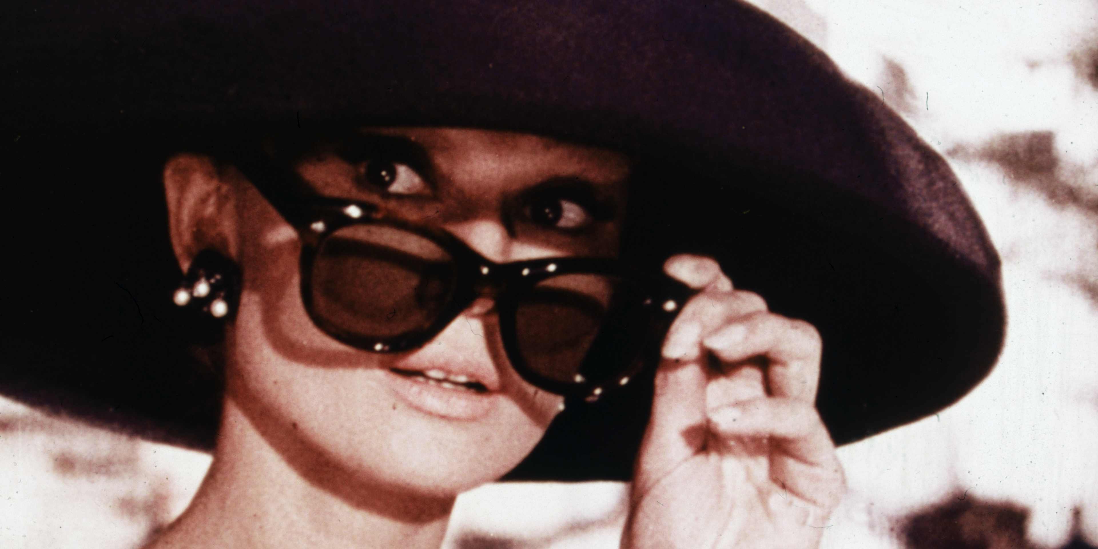 Belgian-born actress Audrey Hepburn lowers her sunglasses in a still from director Blake Edwards' film, 'Breakfast at Tiffany's.'