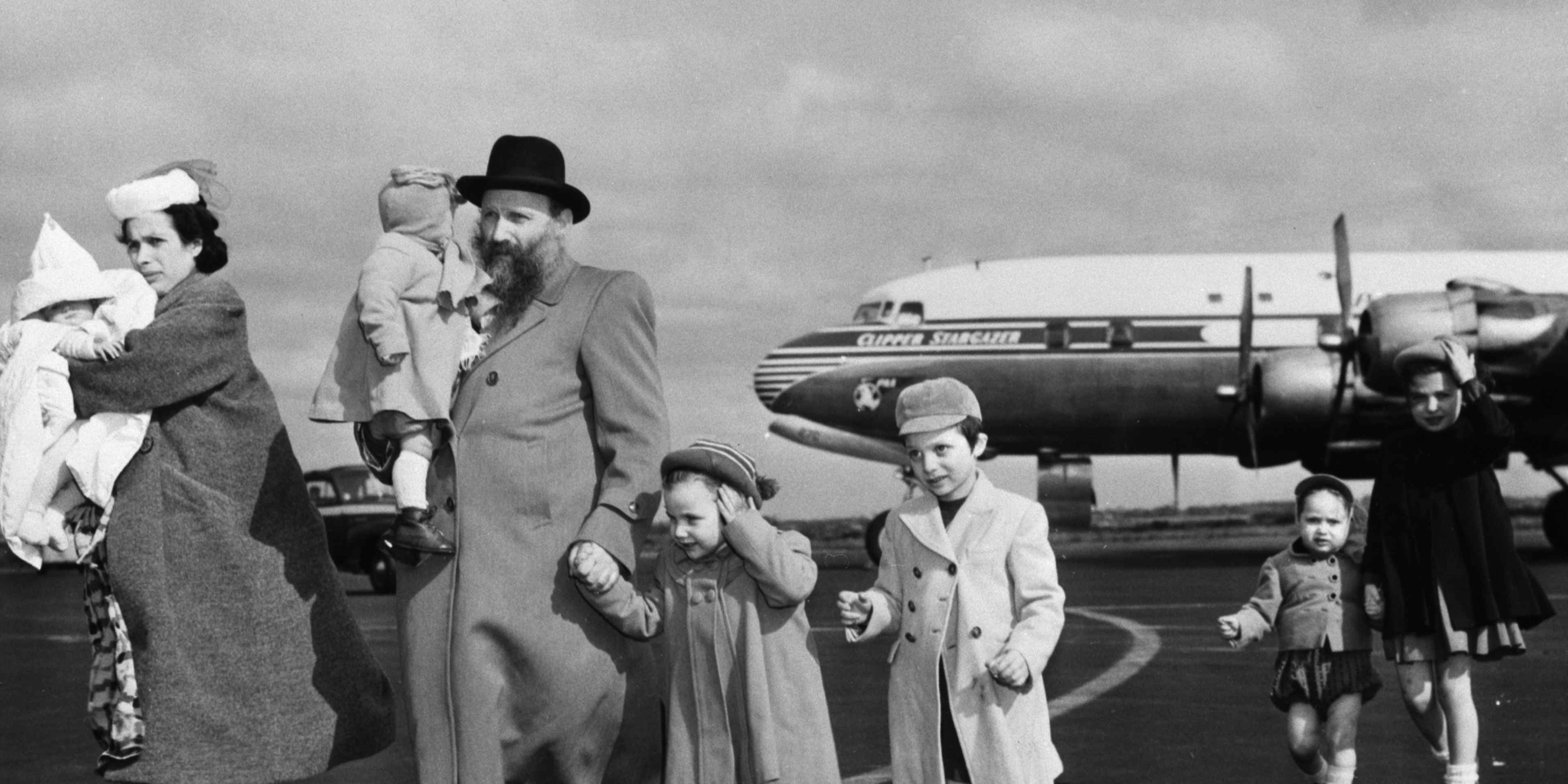 Chaim and Bina Gasthalter of Poland arrive at New York's Idylwild Airport with their six children for resettlement in Detroit. Gasthalter spent five years in Russian slave labor camps.