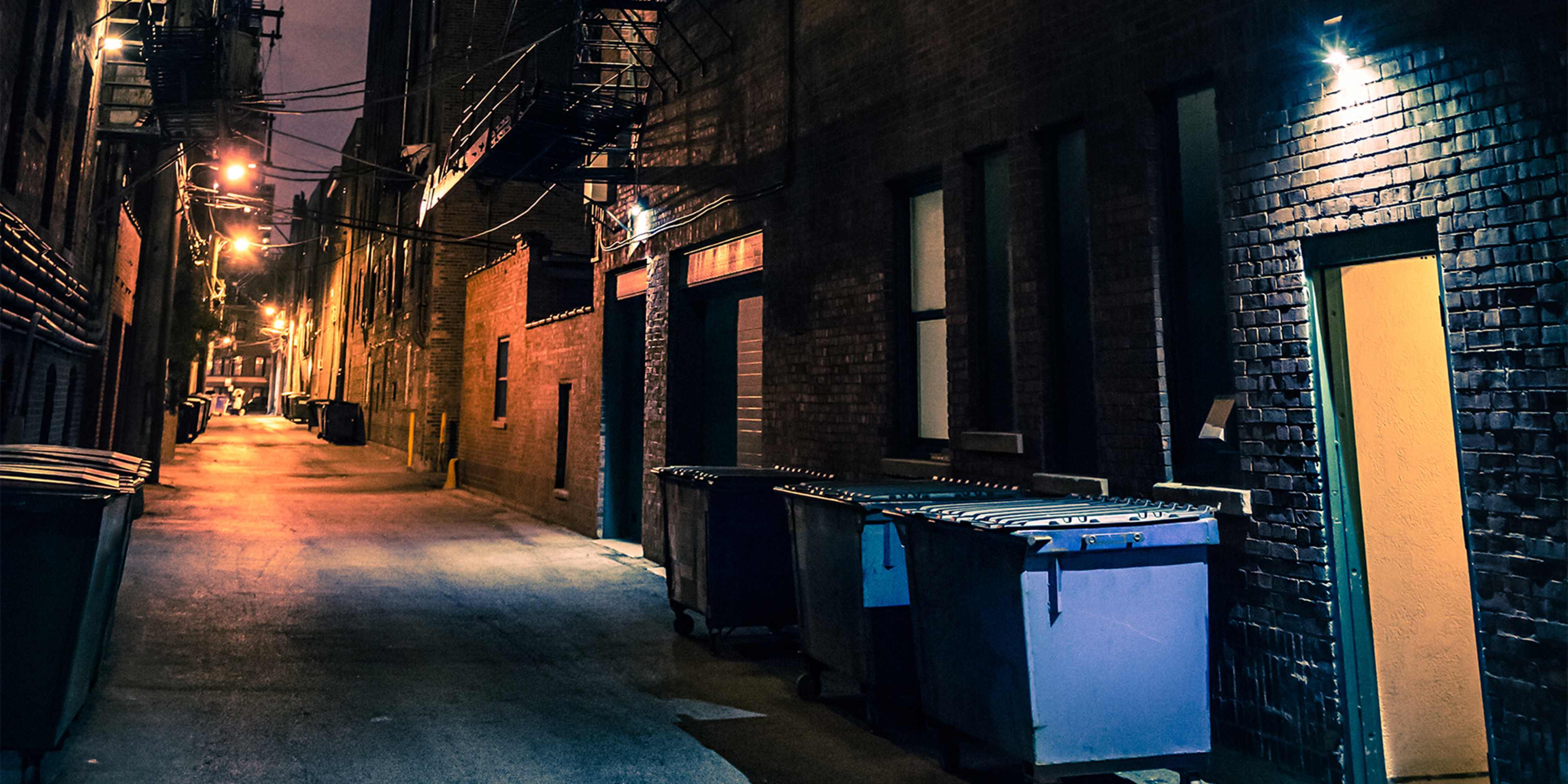 Dark and eerie urban city alley at night