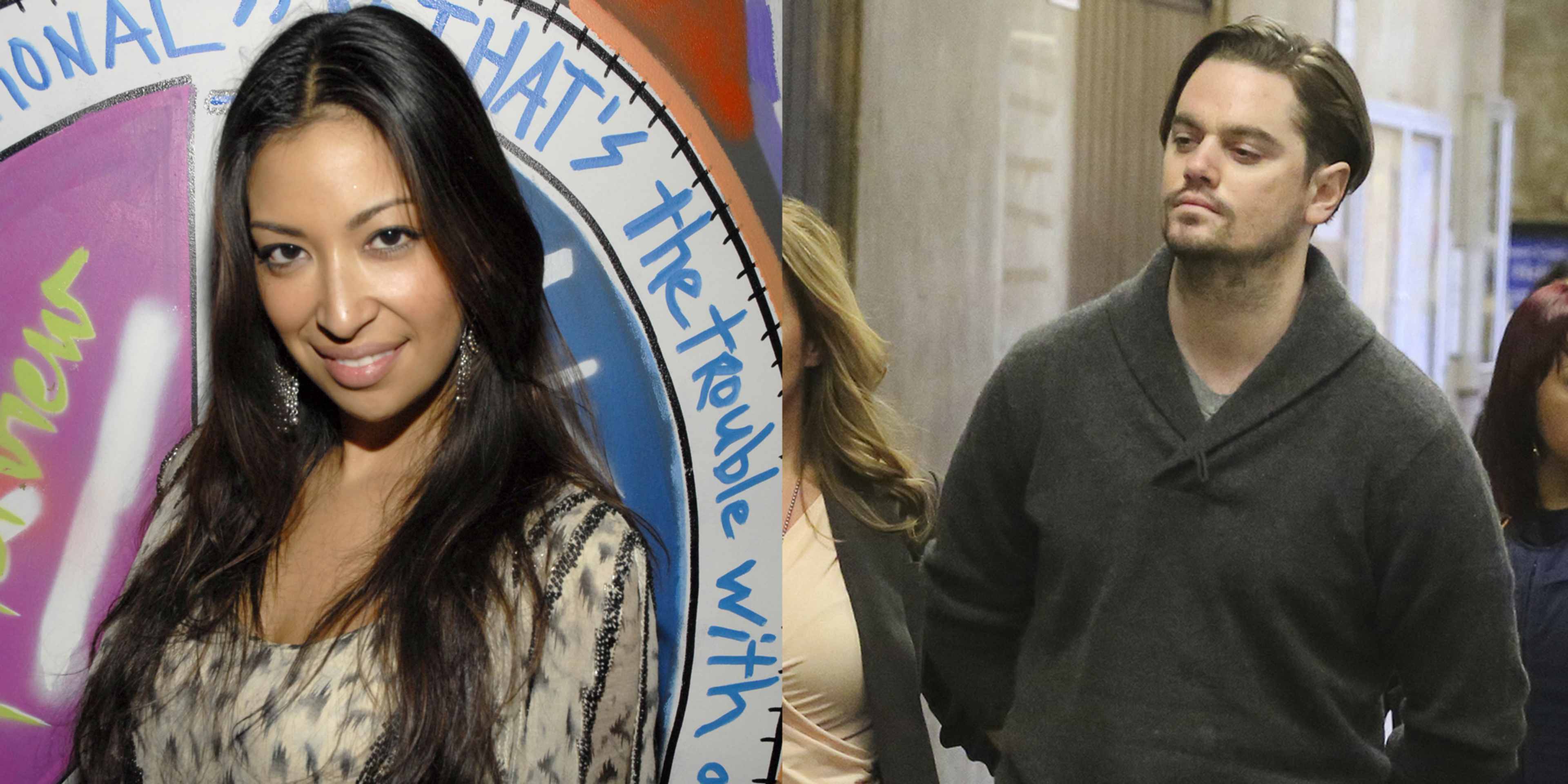 The image shows a smiling woman with long dark hair standing in front of a colorful banner, while a man with a serious expression stands next to her.