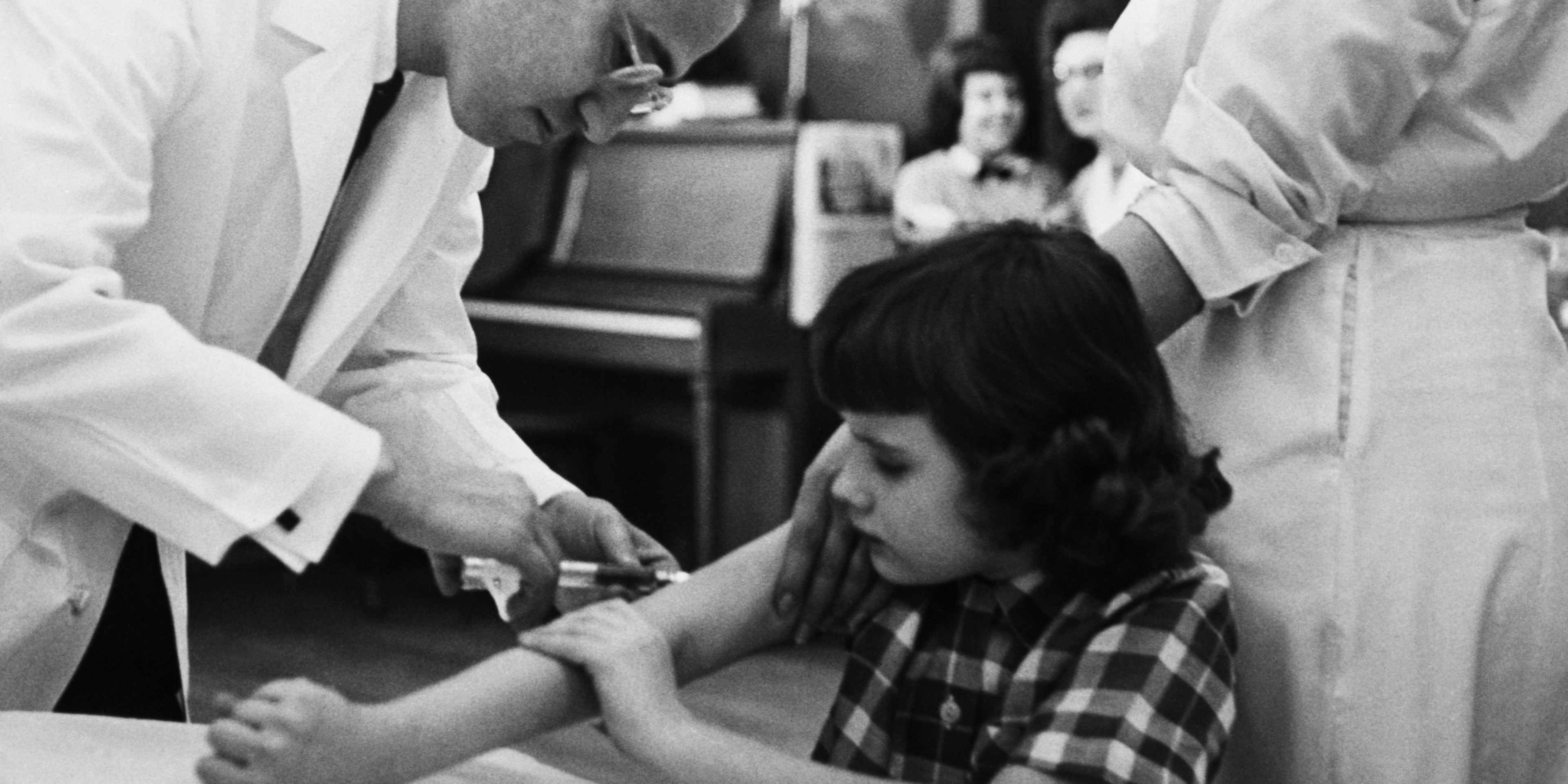Jonas Salk Giving Girl Vaccination Shot