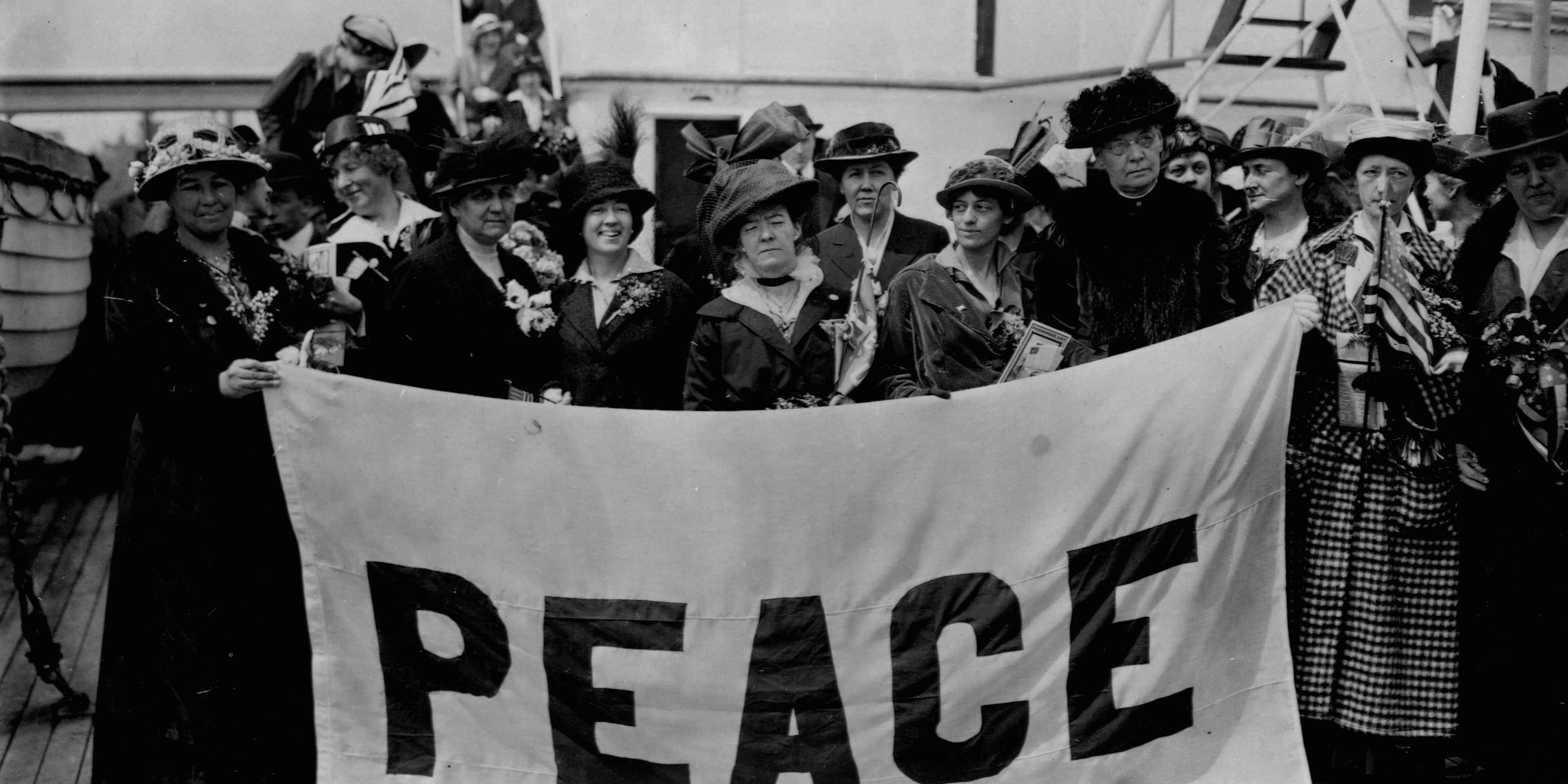 Members of the Women's Peace Party arrive for the International Congress of Women, a four-day antiwar protest held at The Hague. Frieda Lawrence and Jane Addams have their names written above them.
