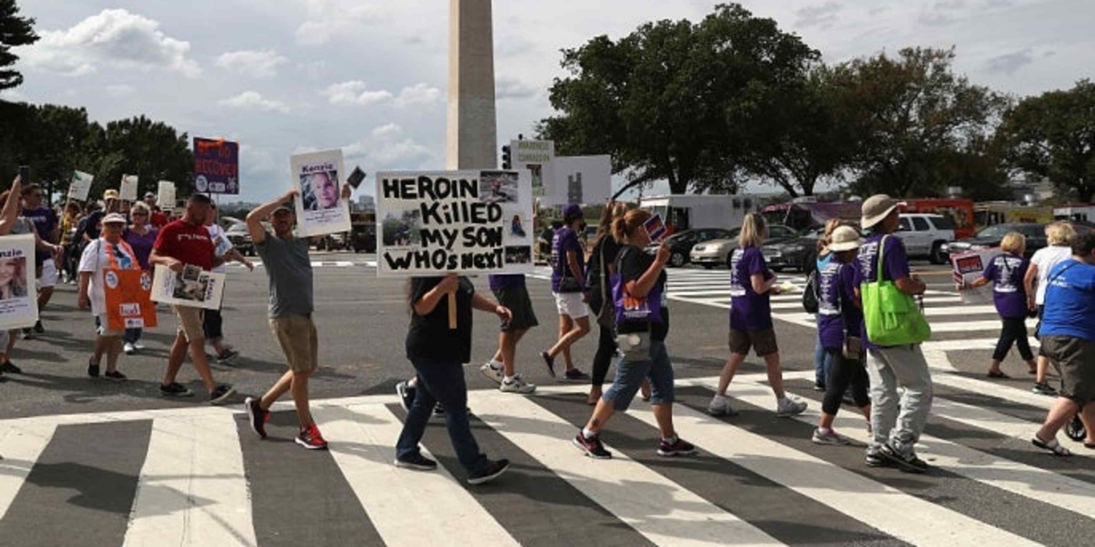 Activists and family members of loved ones who died in the opioid/heroin epidemic march in a "Fed Up!" rally on the National Mall on September 18, 2016.