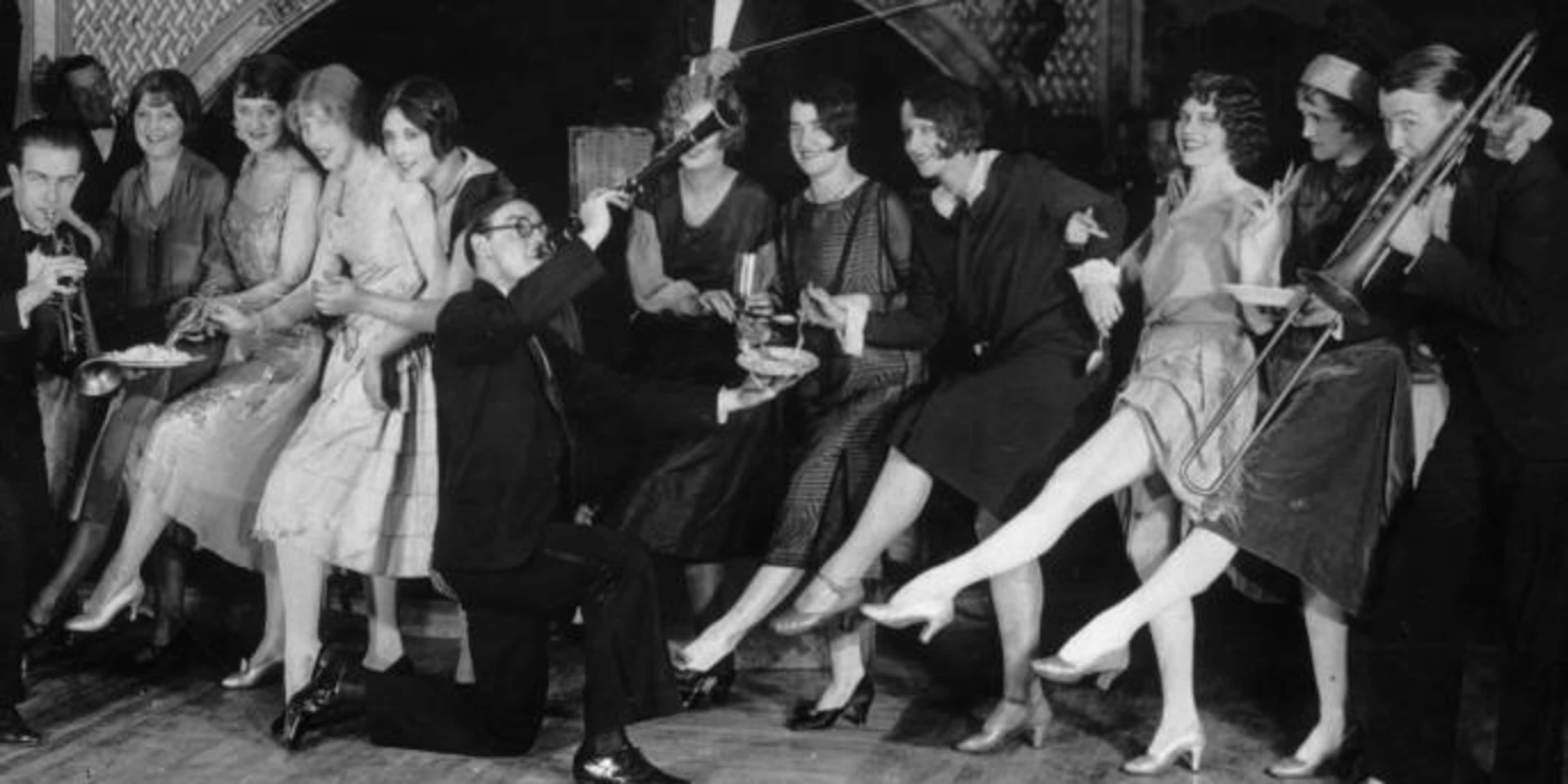 Flappers dancing while musicians perform during a Charleston dance contest at the Parody Club, New York City, 1926.