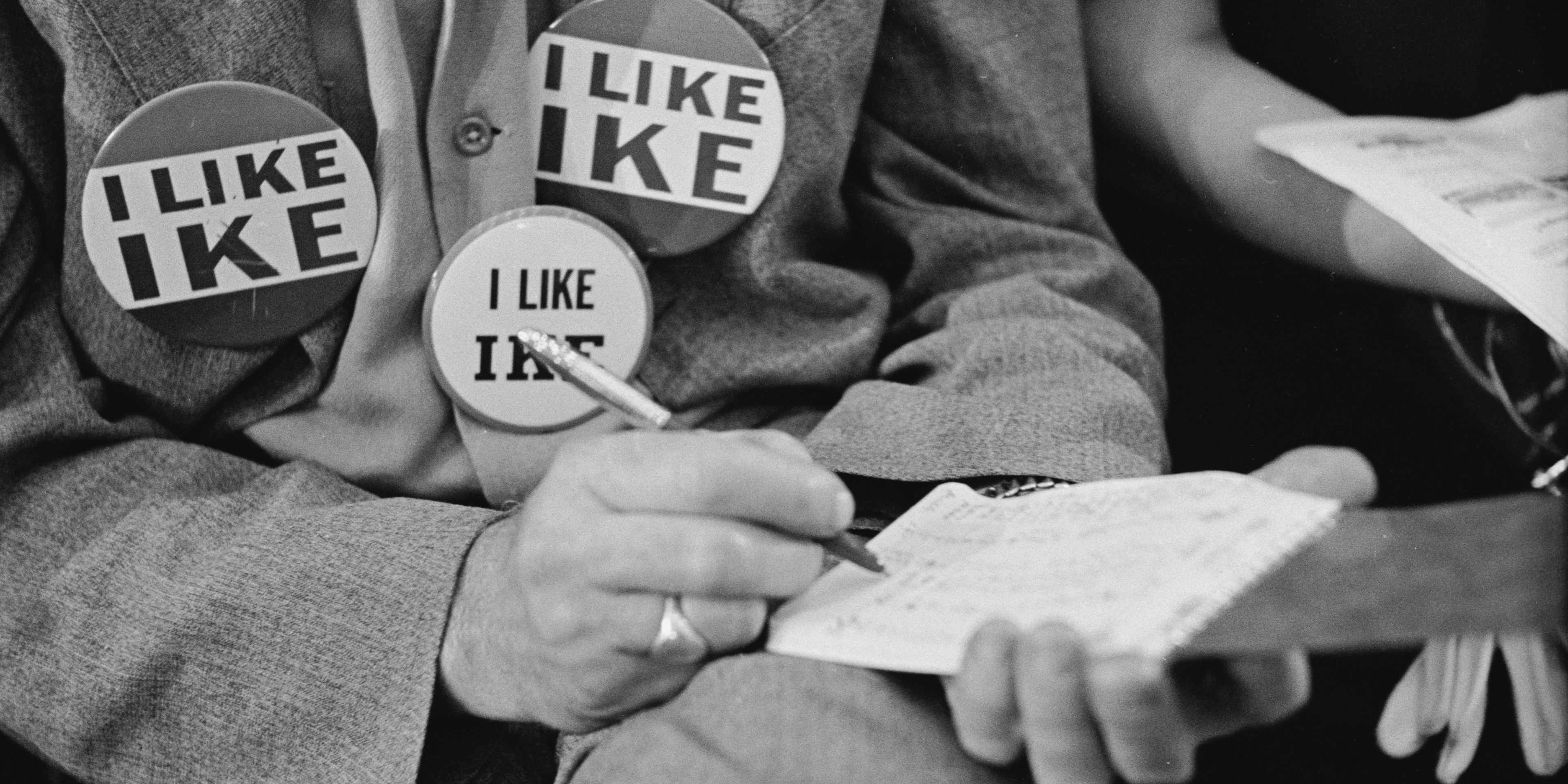 A supporter of presidential candidate Dwight D Eisenhower, aka Ike, wearing three 'I Like Ike' badges at the 1952 Republican National Convention in Chicago, Illinois, July 1952.