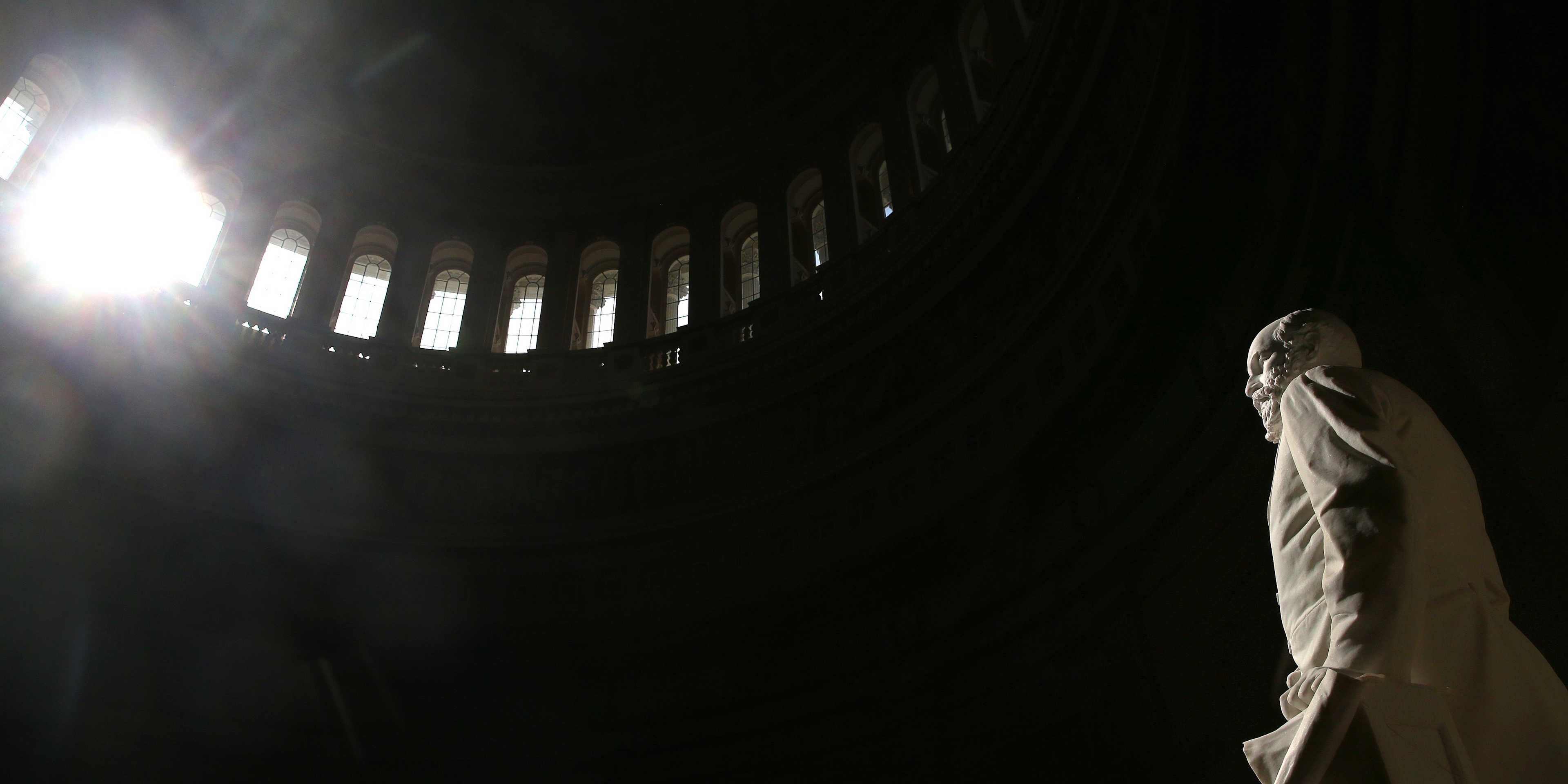 A statue of the 20th U.S. President, James A. Garfield stands inside the Capitol Rotunda as sunlight shines through the window, on February 20, 2014 in Washington, DC.