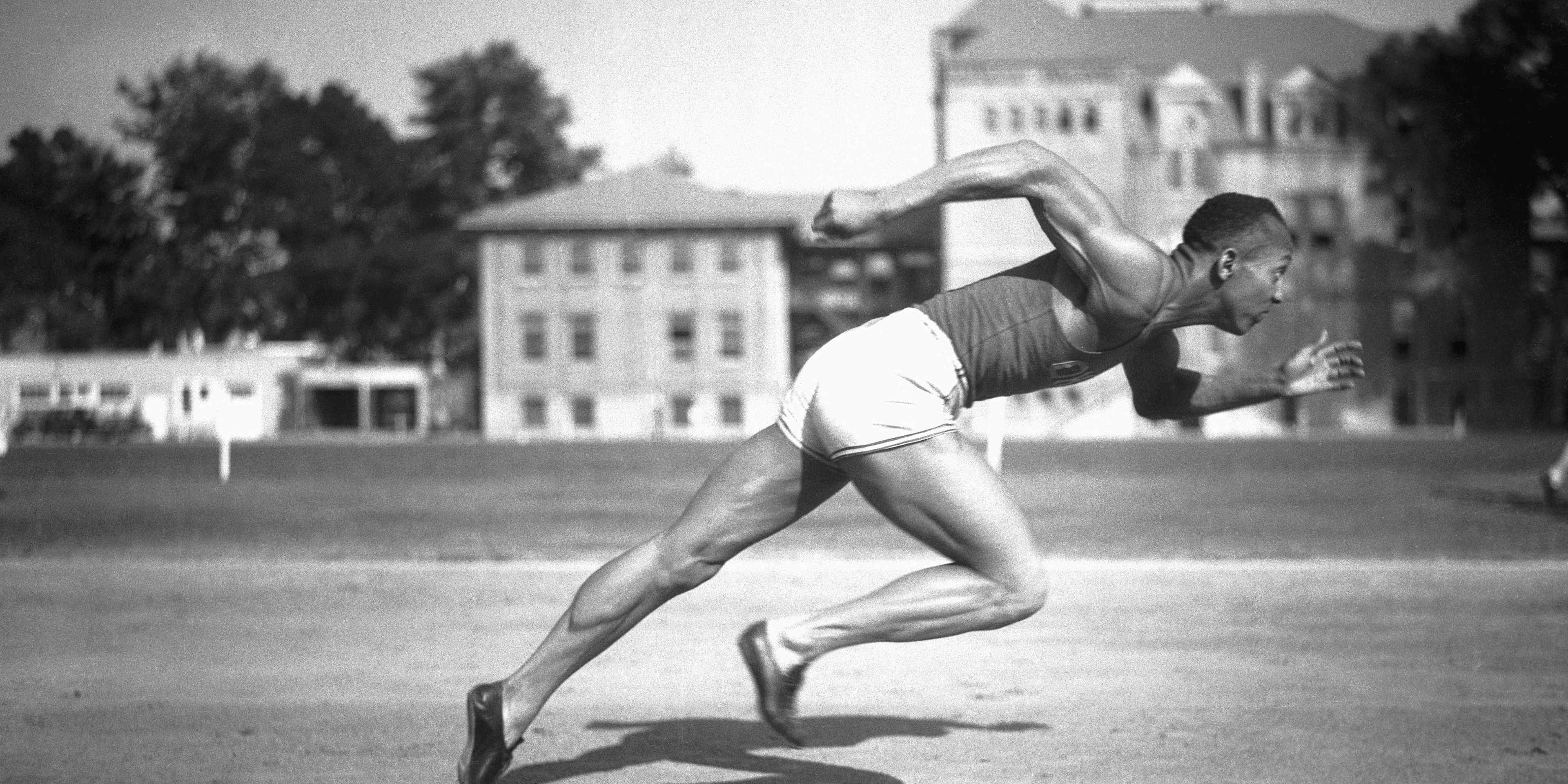Jesse Owens, Ohio State's sensational athlete, is shown in the midst of running a sprint circa 1935.