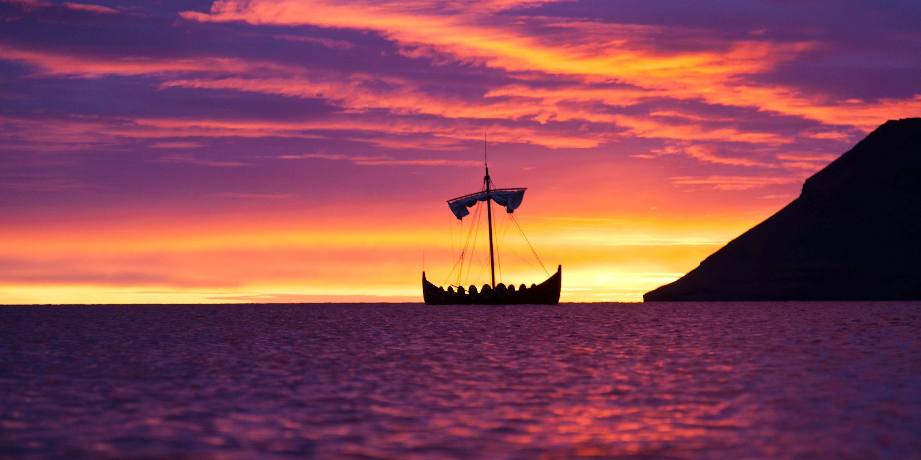 A Viking ship at sunset.