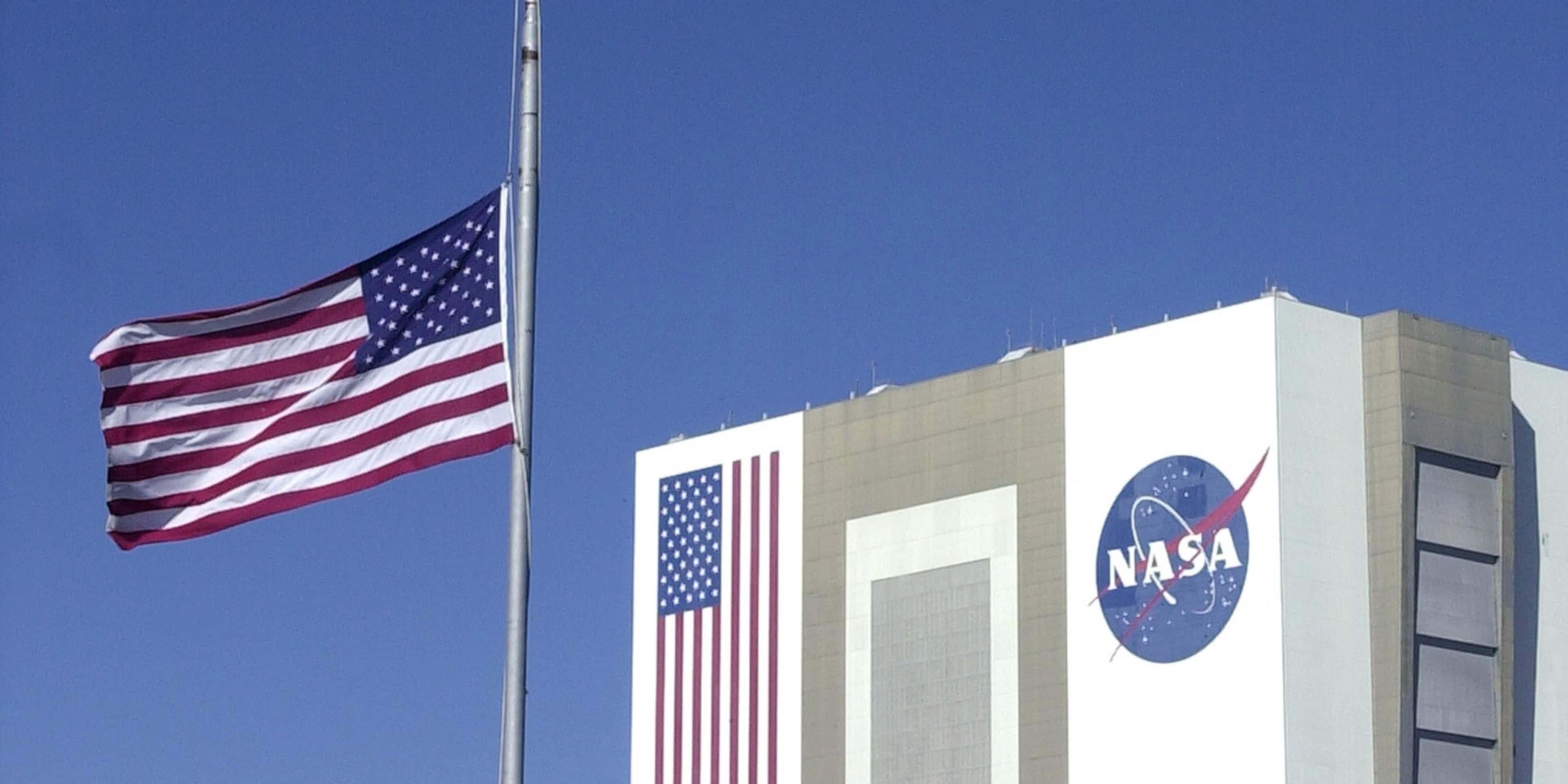 Flag flies at half-staff at the Kennedy Space Center in Cape Canaveral on the day after seven astronauts died in the explosion of the space shuttle Columbia on its way to a landing in Florida.