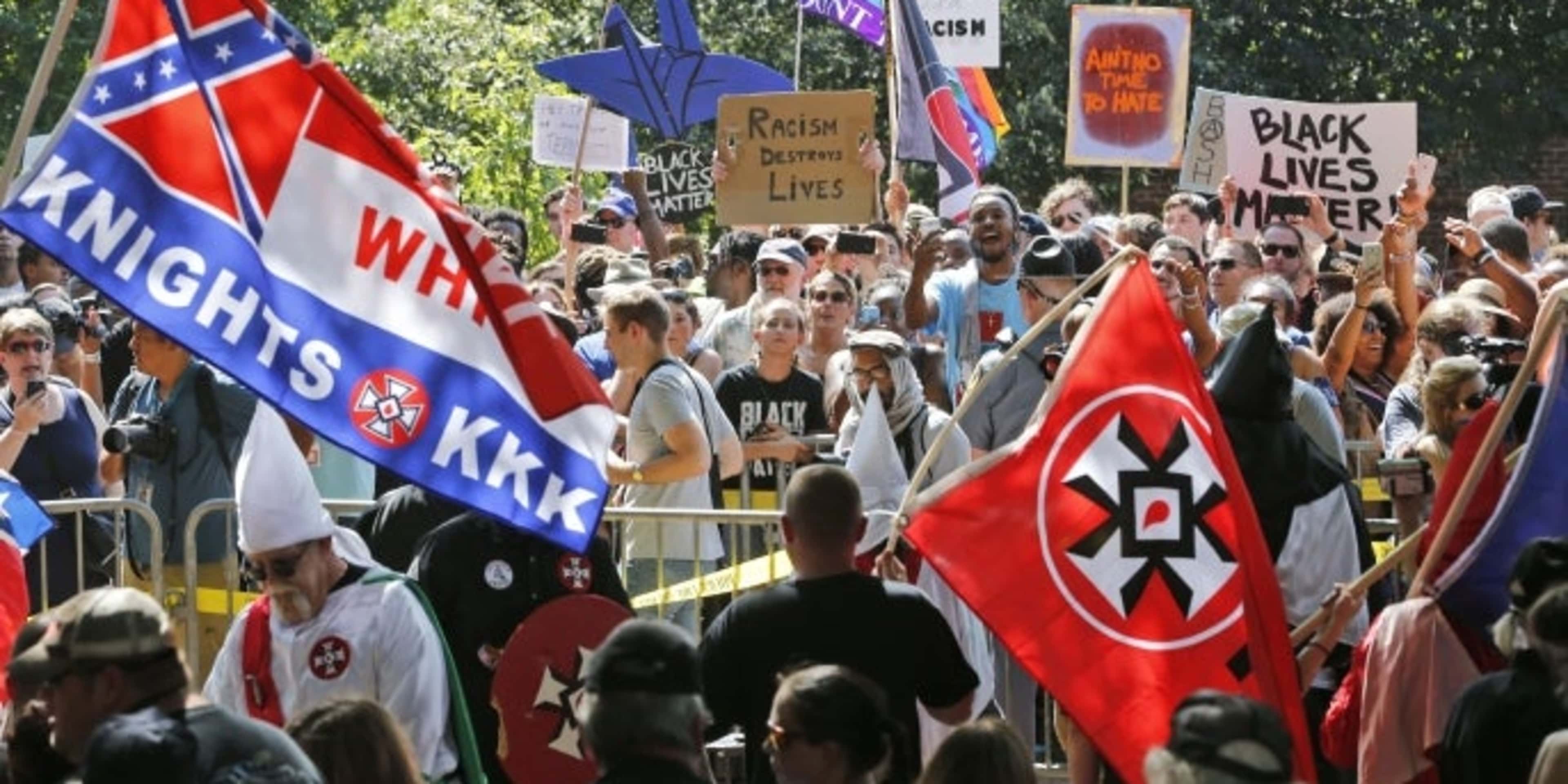 A large group of protesters demonstrate against a KKK rally in Justice Park, in Charlottesville, Virginia, 2017. (Credit: AP/REX/Shutterstock)