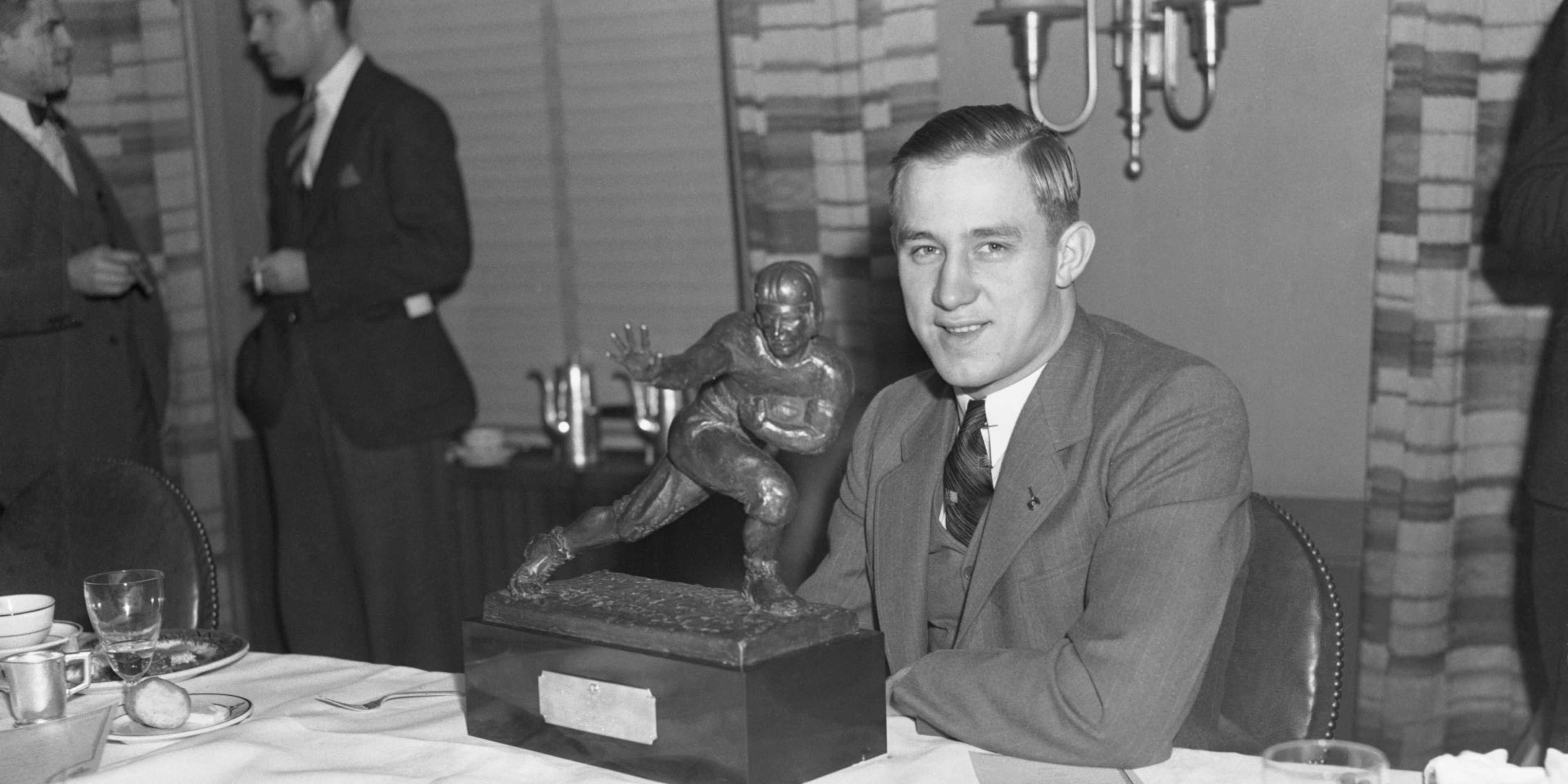 New York: The All All-America of 1935--A close up of Jay Berwanger, ace backfield man of the University of Chicago, shown holding the bronze trophy of the downtown Athletic Club, with which he was presented today, December 10th, after his selection as the Outstanding Football Player of 1935. Berwanger is the only football player in the country to have been selected on All All-America Teams.