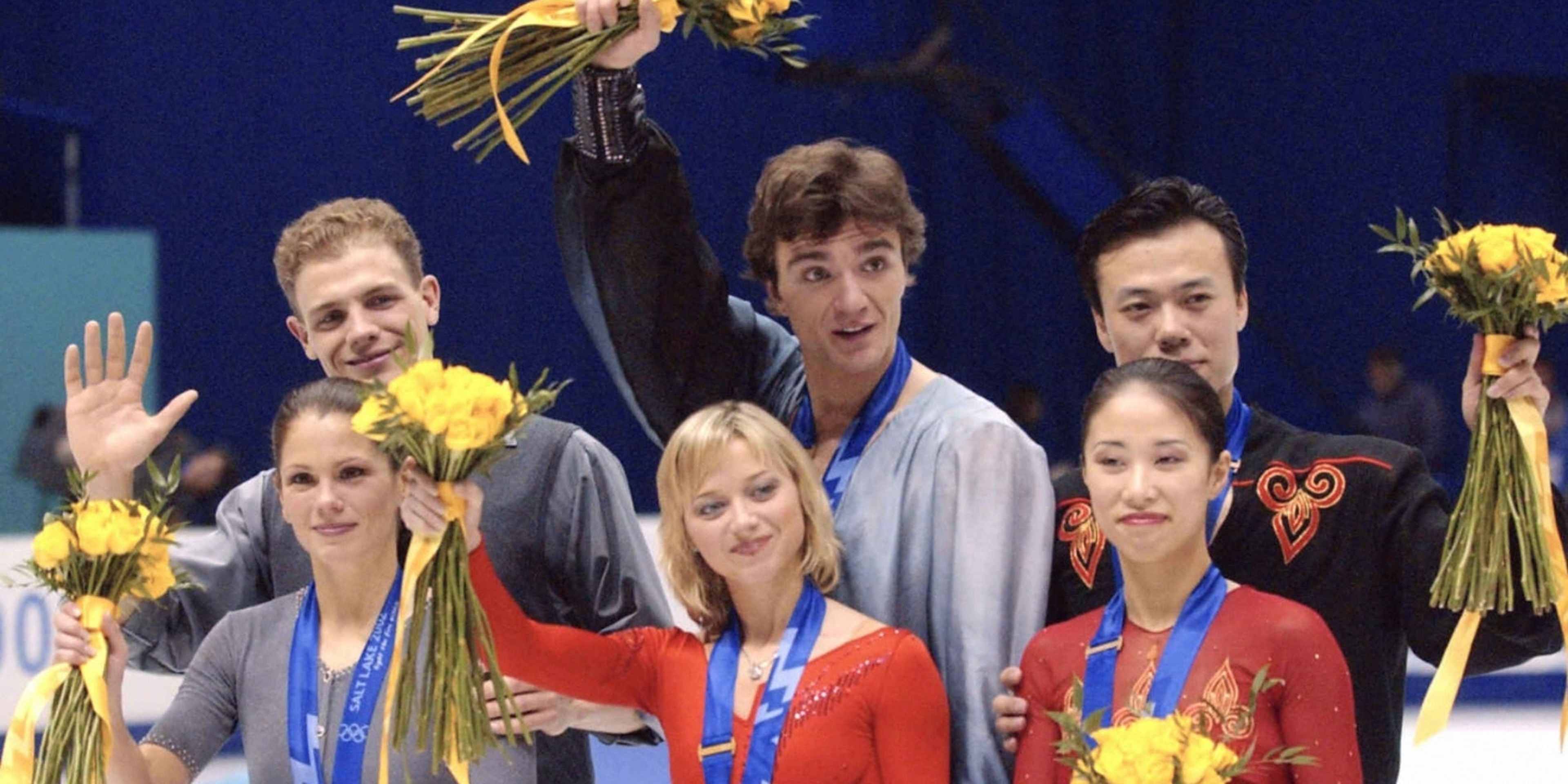 SALT LAKE CITY, UT - FEBRUARY 11: Silver medalists Jamie Sale and David Pelletier of Canada, gold medalists Elena Berezhnaya and Anton Sikharulidze, bronze medalists Shen Xue and Zhao Hongbo of China pose on the podium at the medal ceremony for the Figure Skating Pair during day three of the Salt Lake City Olympics at the Salt Lake Ice Center on February 11, 2002 in Salt Lake City, Utah. (Photo by The Asahi Shimbun via Getty Images)
