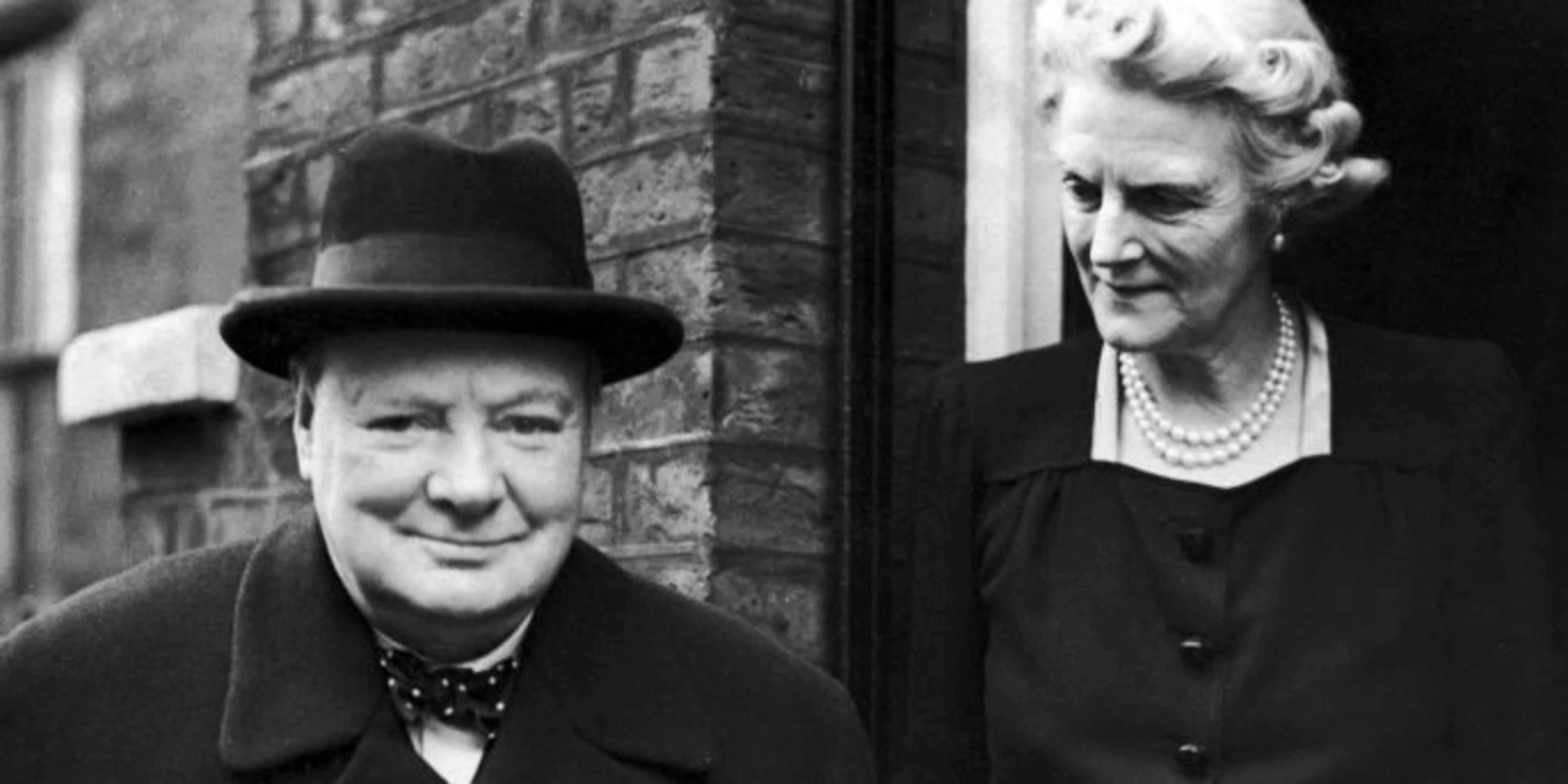 On his 71st birthday, former British Prime Minister Winston Churchill and his wife Clementine leaving their home at Hyde Park Gate, to attend a commons debate, 1945. (Credit: Keystone/Hulton Archive/Getty Images)