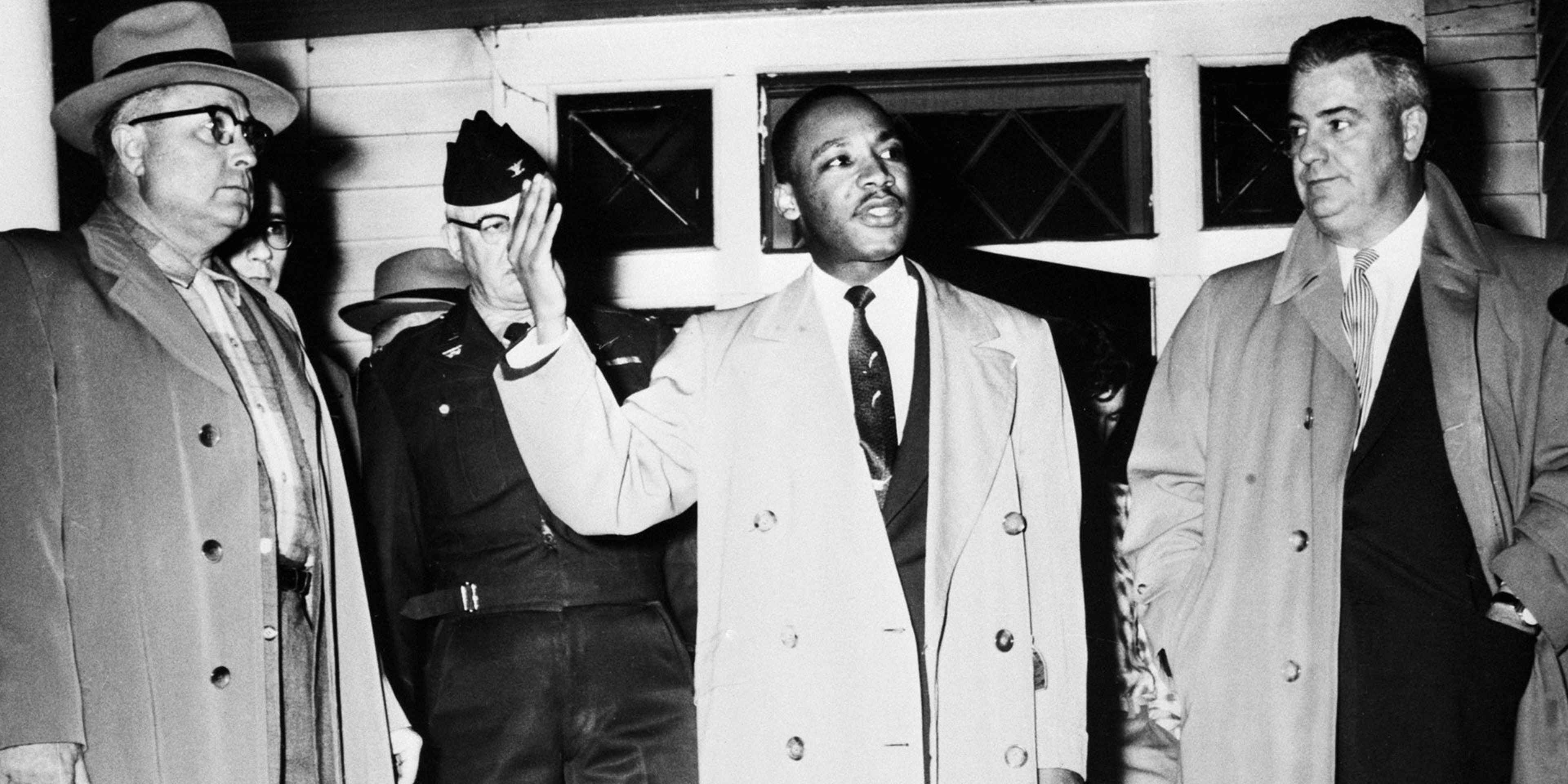 The Rev. Martin Luther King Jr. addresses a crowd from his front porch, at his home in Montgomery, Ala., on Jan. 30, 1956, after it was bombed.