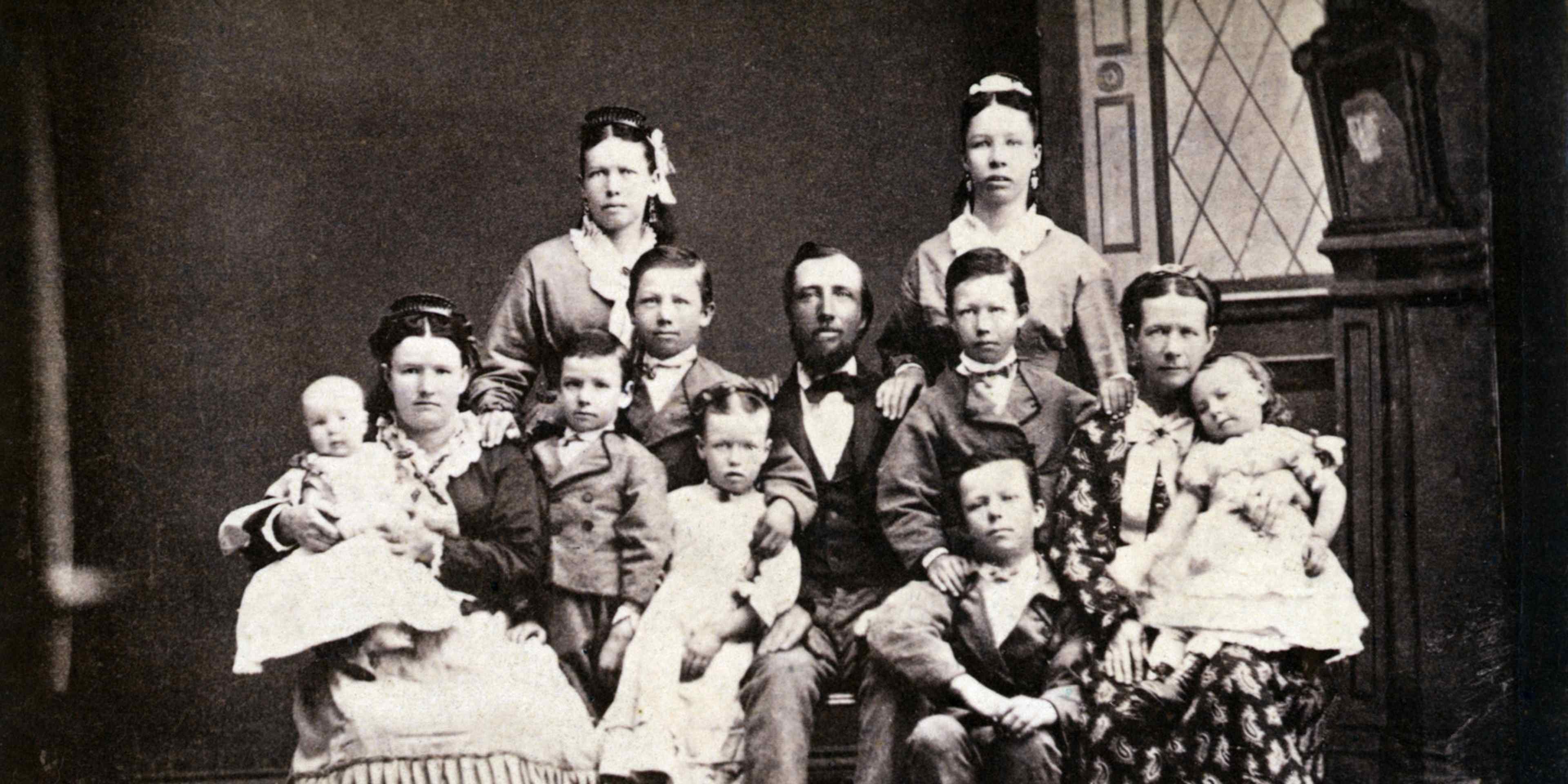 Mormon Family with Two Wives and Nine Children (Original Caption) Mormons. Typical Mormon family, PA. Two wives and nine children. Photograph of the 1870's.