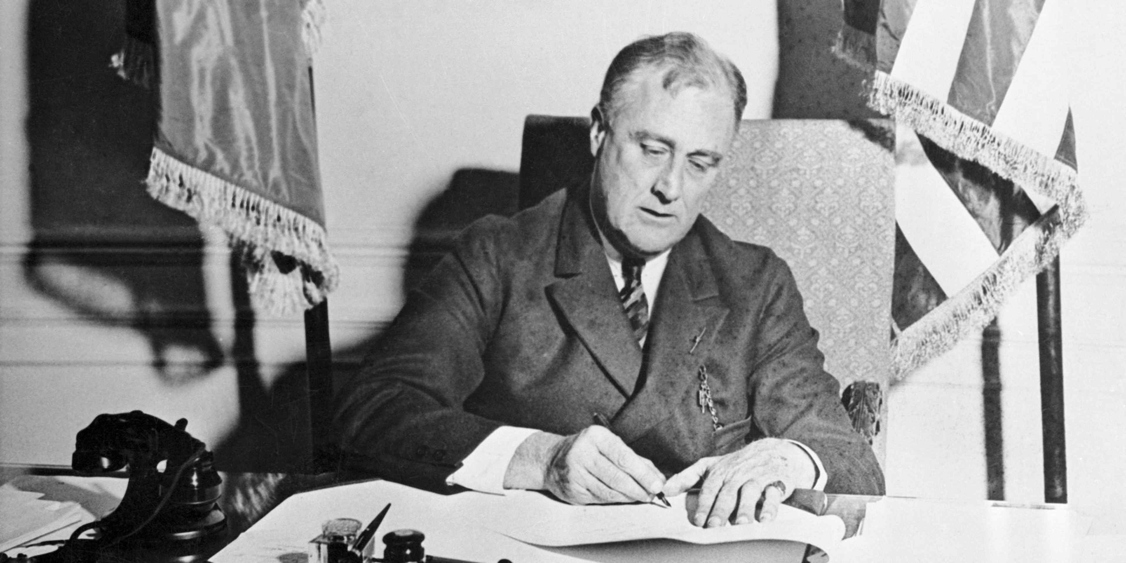 Franklin Roosevelt Signing the Emergency Banking Act.