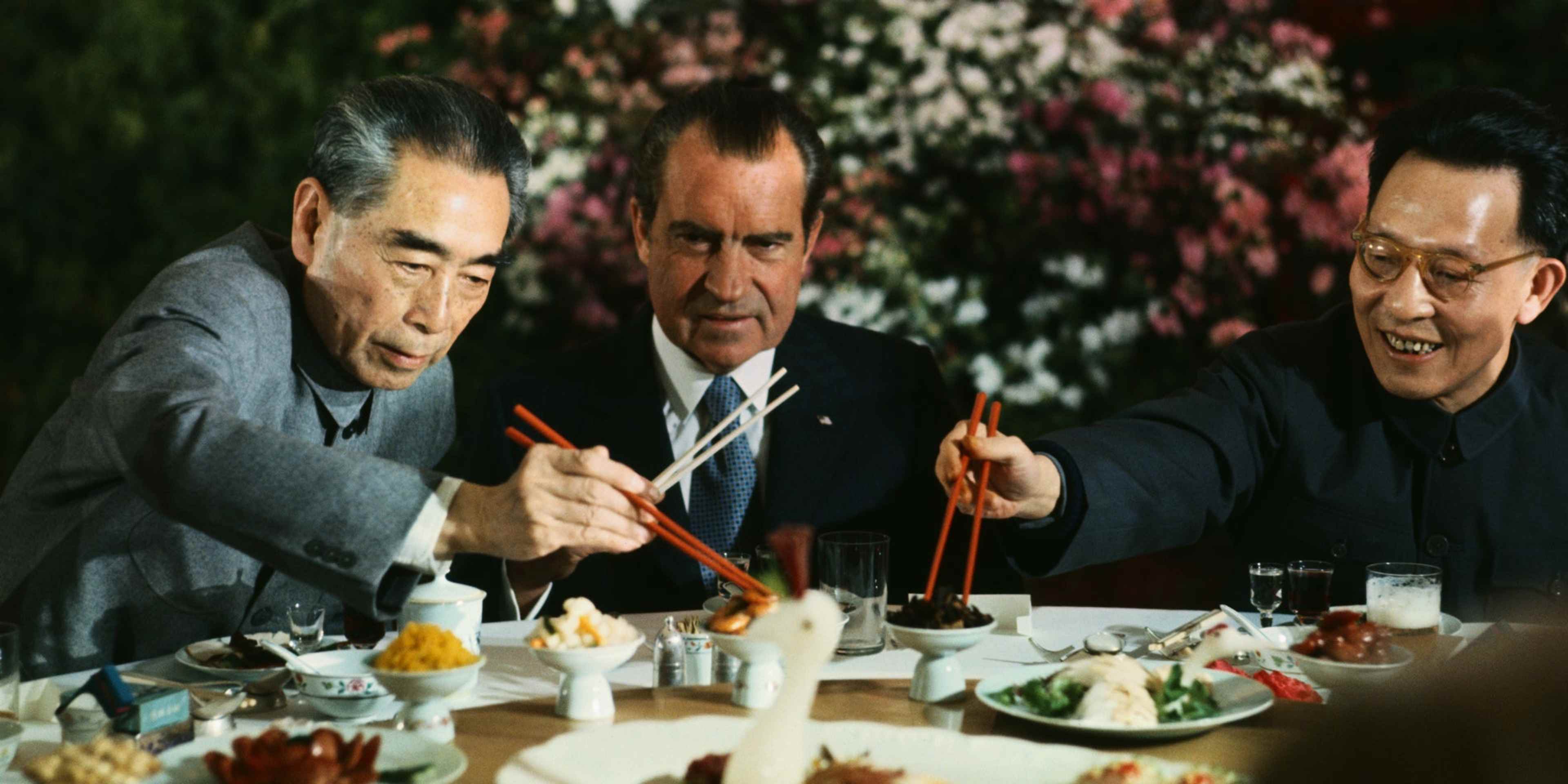 President Richard Nixon shares a meal with Premier Chou En-lai (left) and Shanghai Communist Party leader Chang Chun-chiao on February 27, 1972.