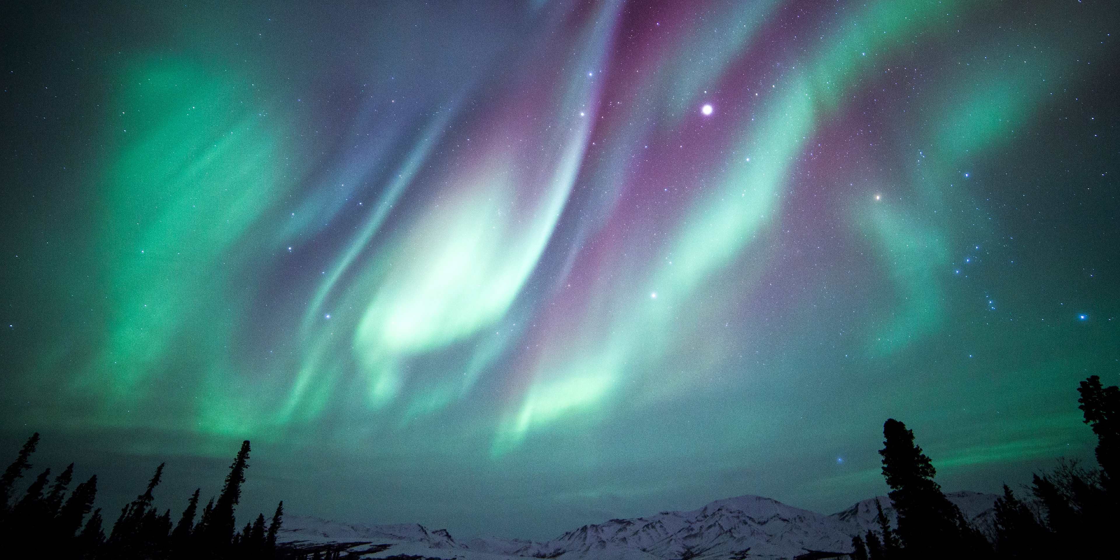 The Aurora Borealis, Orion and Jupiter over Denali National Park in Alaska.