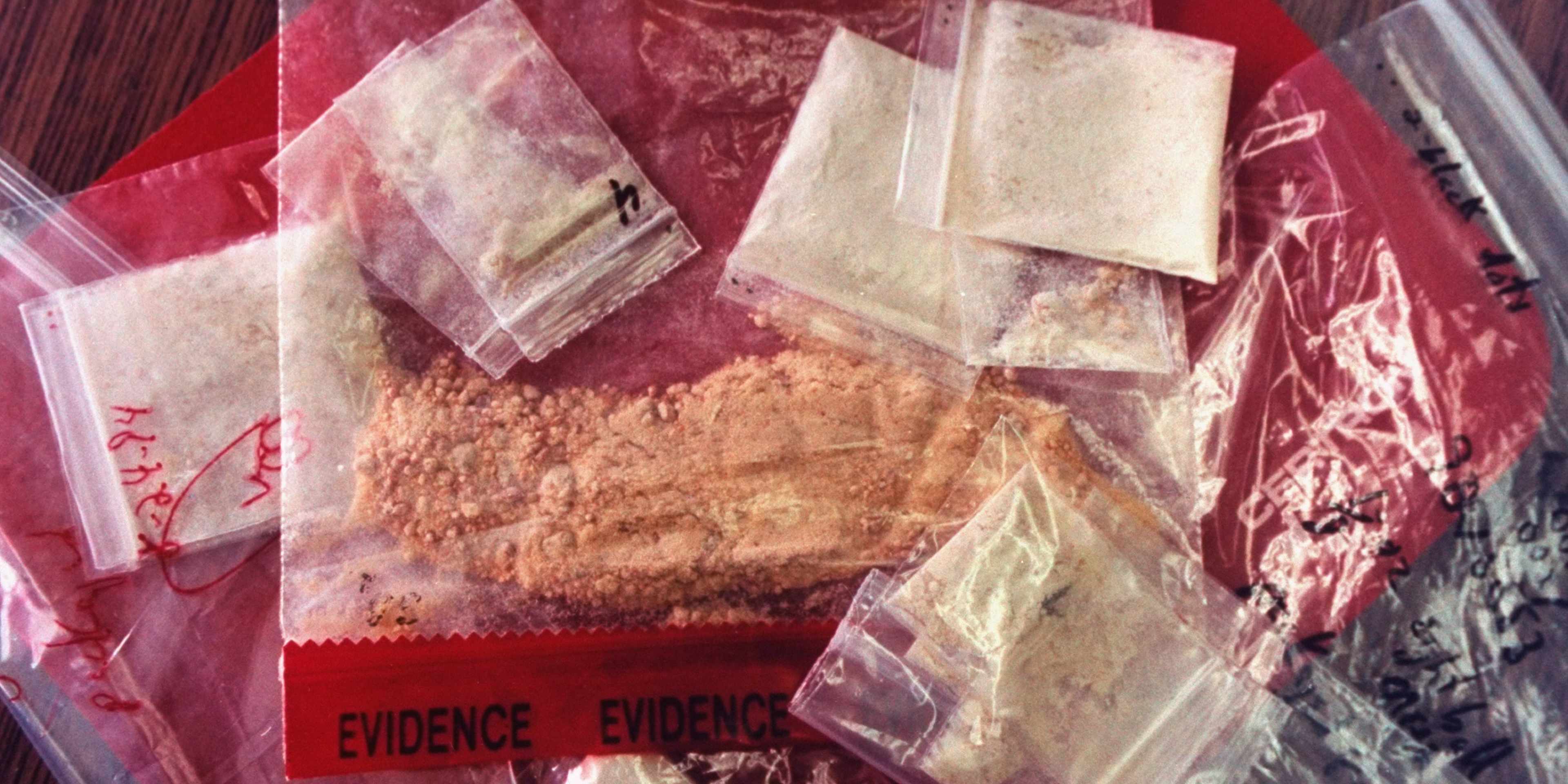 Plastic bags of crank (methamphetamine) in police custody after drug bust