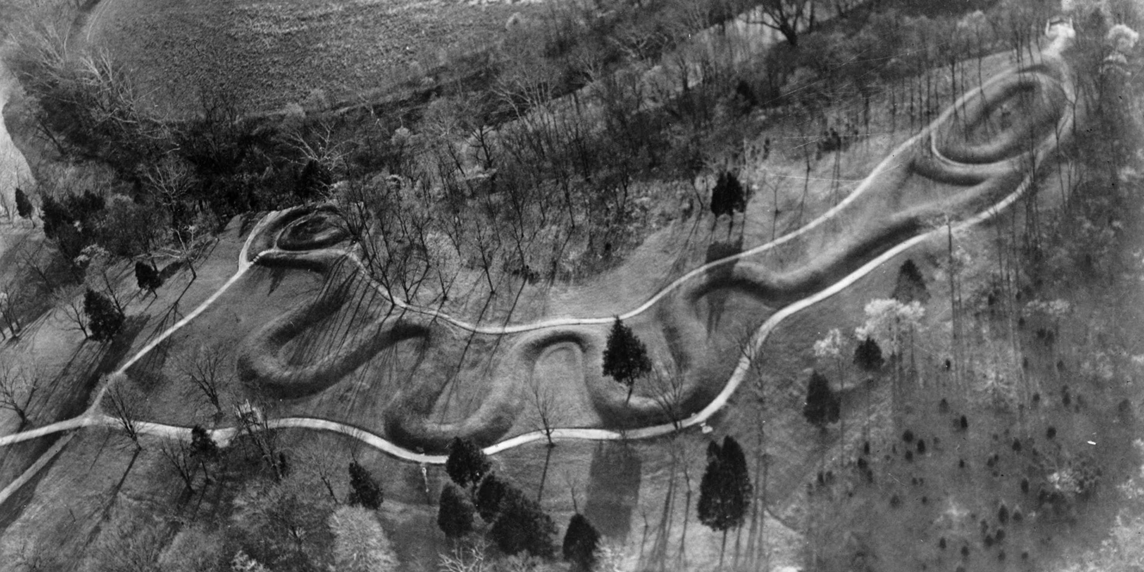The Great Serpent Mound in Adams County, Ohio, built by the Adena people between 800 BC and AD 400. This protected historical earthworks is nearly a quarter of a mile long and represents a giant snake holding an egg in its jaws.