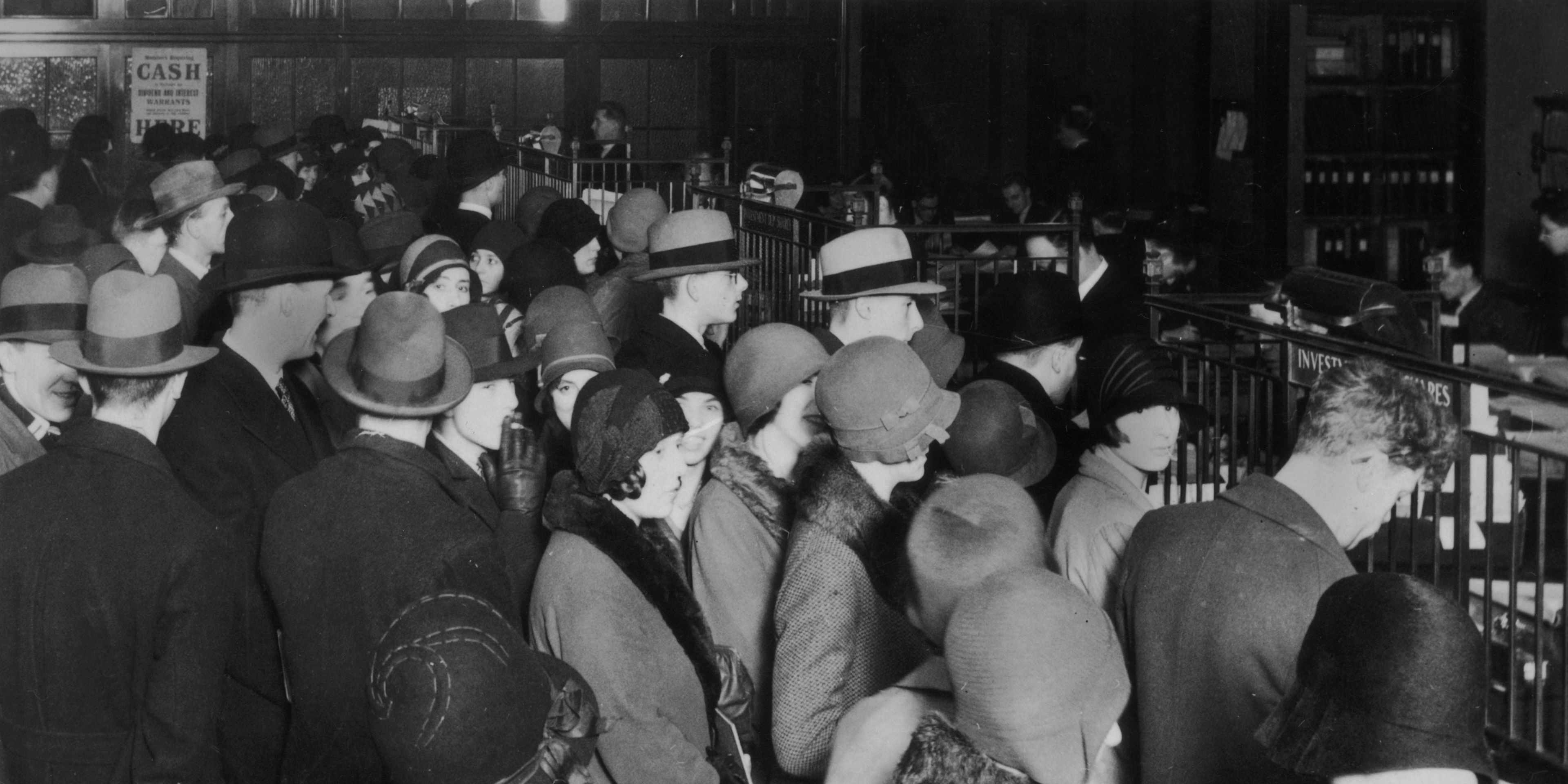 Investors rush to withdraw their savings during the stock market crash of 1929.