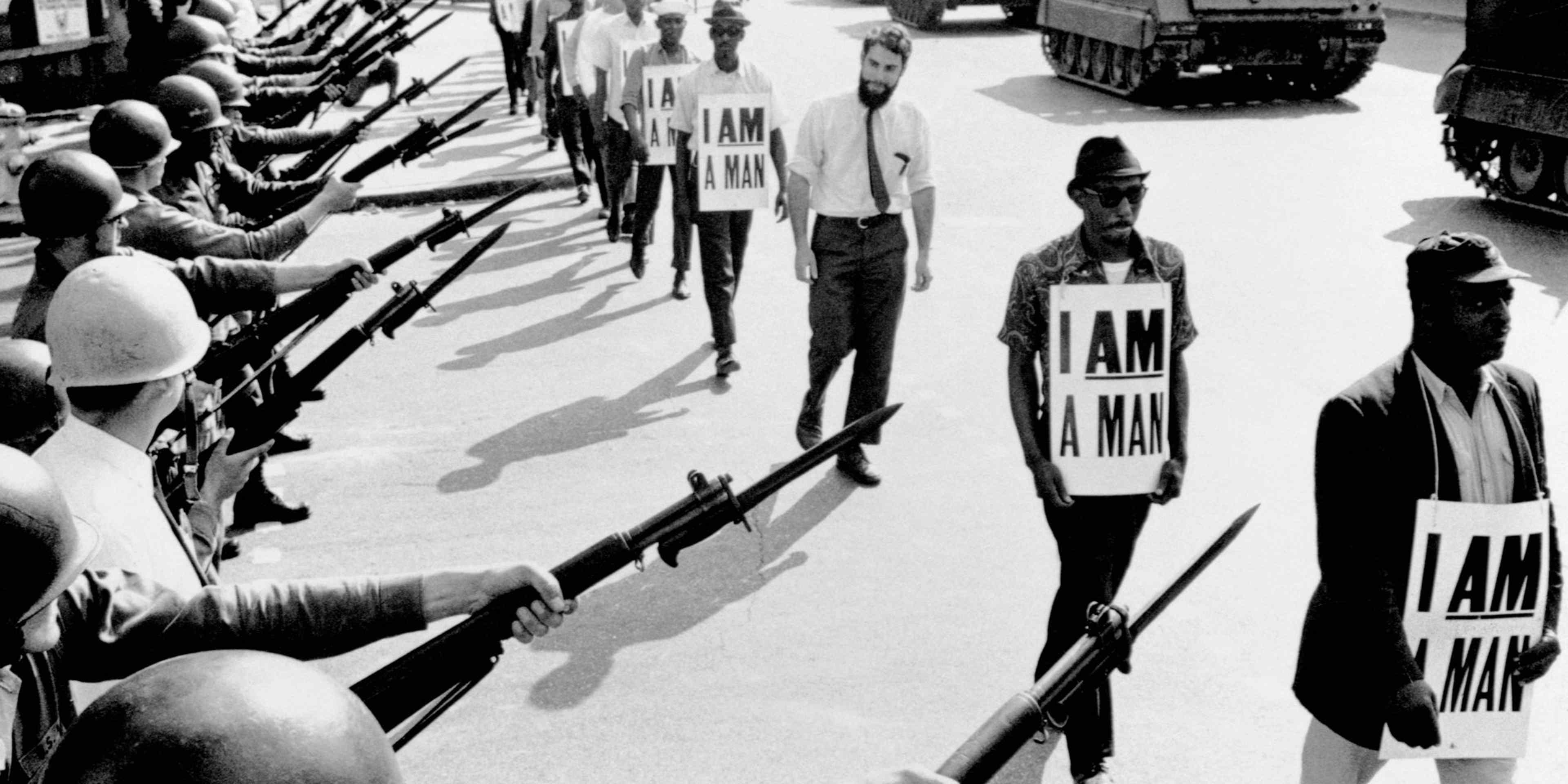 Civil Rights Marchers with "I Am A Man" SignsCivil Rights activists are blocked by National Guardsmen brandishing bayonets while trying to stage a protest on Beale Street in Memphis, Tennessee. The marching demonstrators, who are wearing signs which say "I Am A Man," are also flanked by tanks.