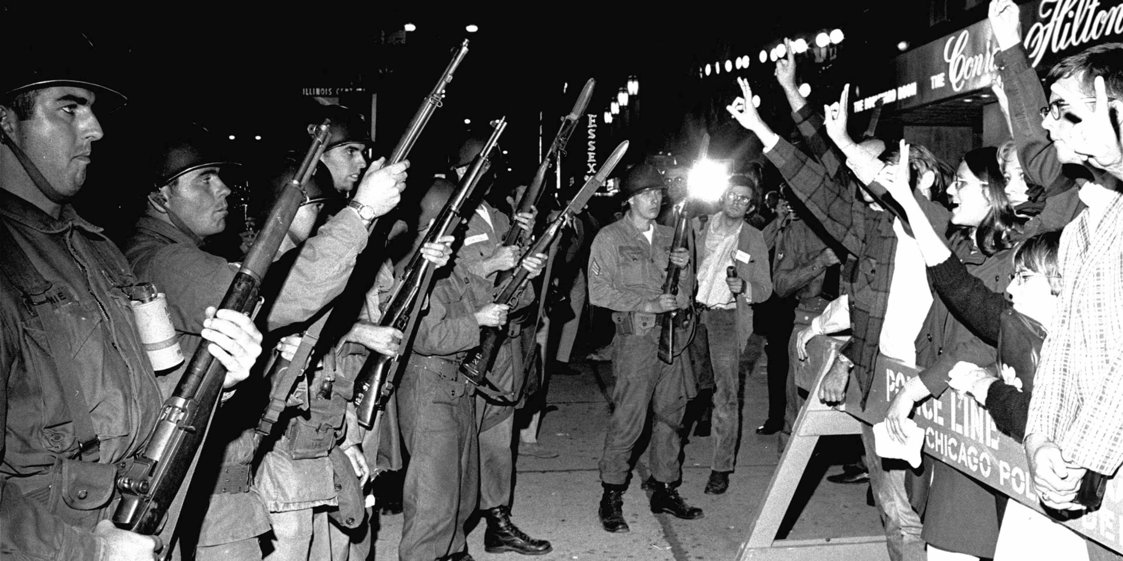 Peace demonstrators taunt Illinois National Guardsmen outside the Democratic National Convention headquarters hotel, on August 29, 1968. (Credit: AP Photo)