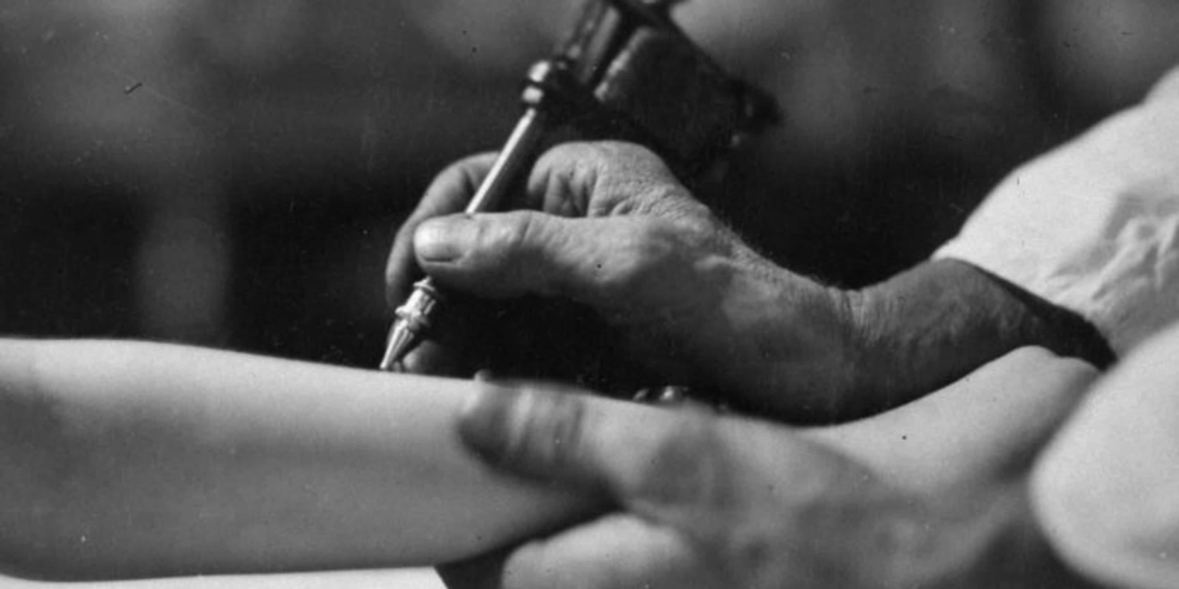 Closeup of a tattooist at work. (Credit: E. O. Hoppe/Mansell/The LIFE Picture Collection/Getty Images)